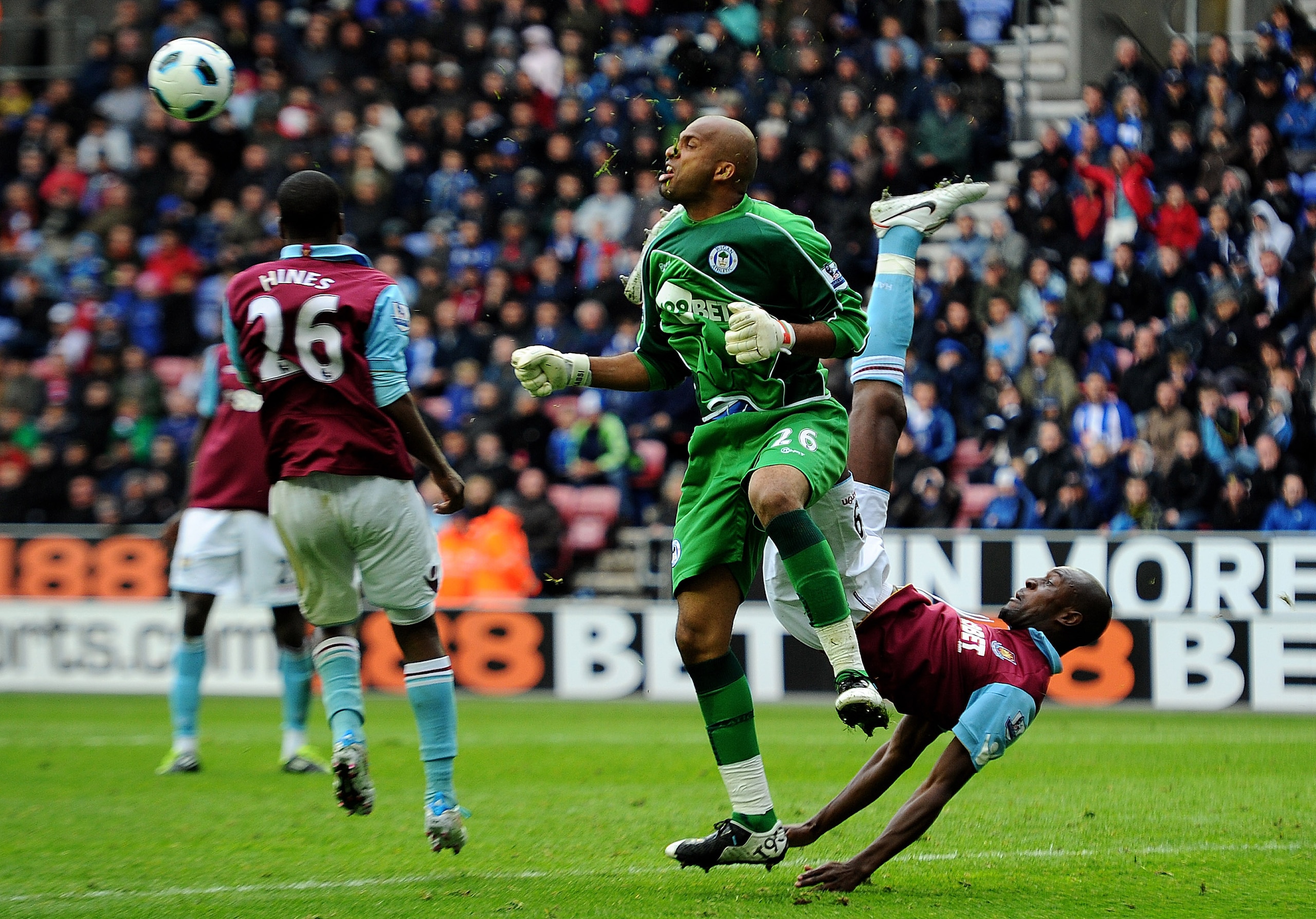 WIGAN, ENGLAND - MAY 15: Ali Al Habsi of Wigan Athletic tangles with Carlton Cole of West Ham United during the Barclays Premier League match between Wigan Athletic and West Ham United at the DW Stadium on May 15, 2011 in Wigan, England. (Photo by Clive WIGAN, ENGLAND - MAY 15: Ali Al Habsi of Wigan Athletic tangles with Carlton Cole of West Ham United during the Barclays Premier League match between Wigan Athletic and West Ham United at the DW Stadium on May 15, 2011 in Wigan, England. (Photo by Clive