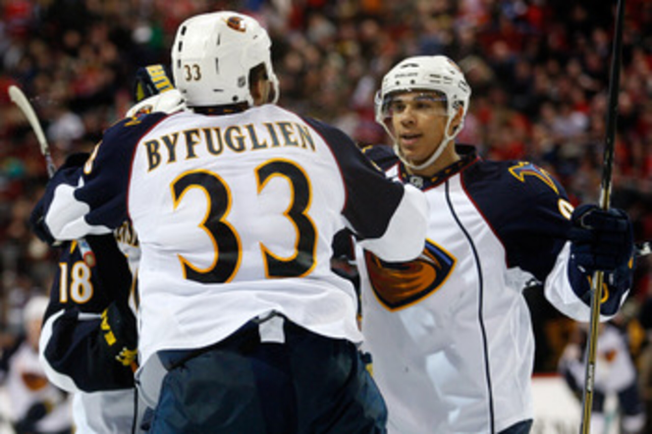 MONTREAL, CANADA - JANUARY 2:  Dustin Byfuglien #33 of the Atlanta Thrashers celebrates his overtime goal with team mates during the NHL game against the Montreal Canadiens at the Bell Centre on January 2, 2011 in Montreal, Quebec, Canada.  The Thrashers 
