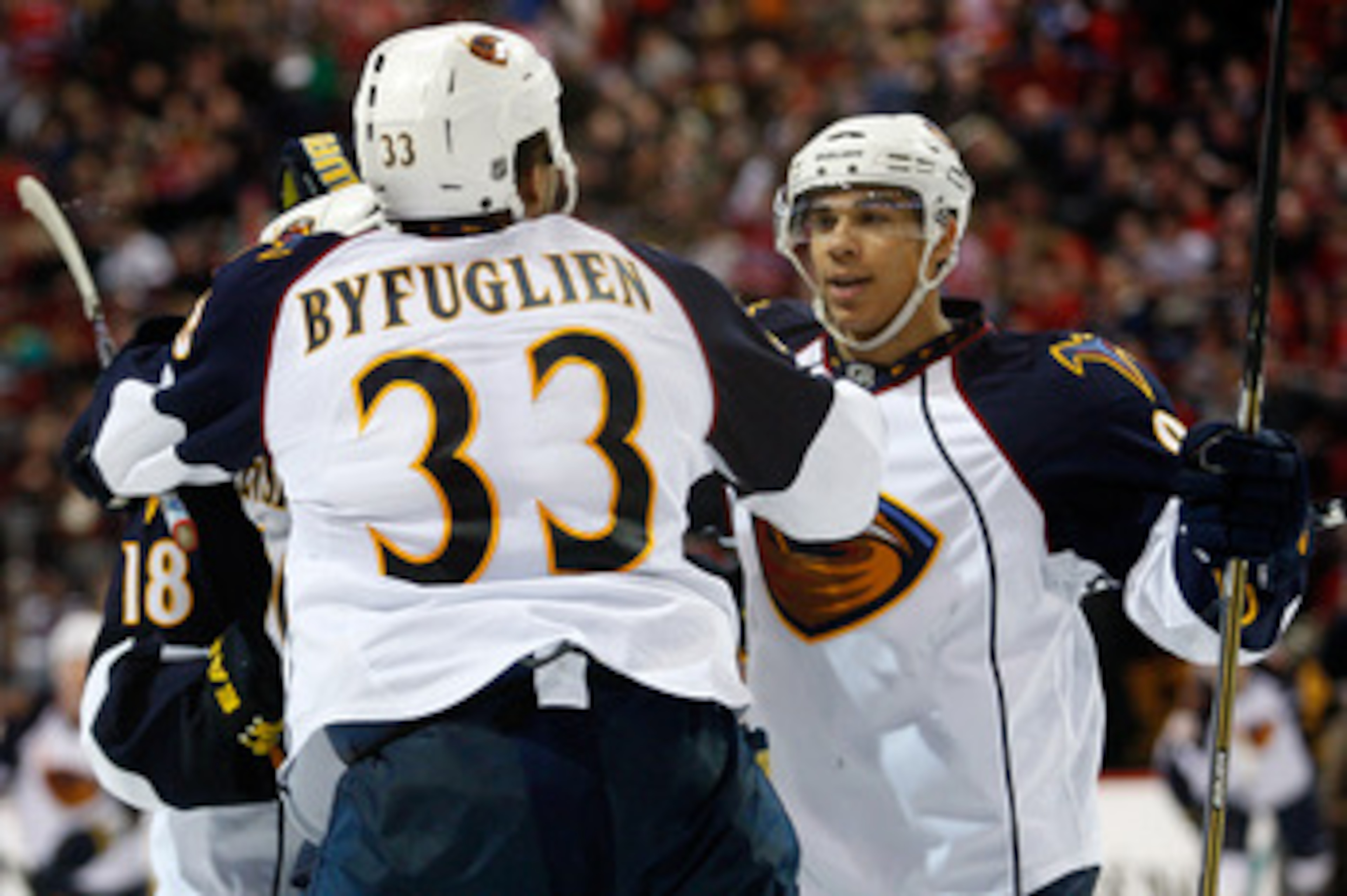 MONTREAL, CANADA - JANUARY 2: Dustin Byfuglien #33 of the Atlanta Thrashers celebrates his overtime goal with team mates during the NHL game against the Montreal Canadiens at the Bell Centre on January 2, 2011 in Montreal, Quebec, Canada. The Thrashers MONTREAL, CANADA - JANUARY 2: Dustin Byfuglien #33 of the Atlanta Thrashers celebrates his overtime goal with team mates during the NHL game against the Montreal Canadiens at the Bell Centre on January 2, 2011 in Montreal, Quebec, Canada. The Thrashers