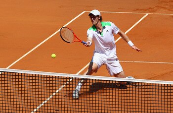 ROME, ITALY - MAY 13:  Andy Murray of Great Britain plays a forehand volley at the net during his quarter final match against Florian Mayer of Germany during day six of the Internazoinali BNL D'Italia at the Foro Italico Tennis Centre  on May 13, 2011 in 