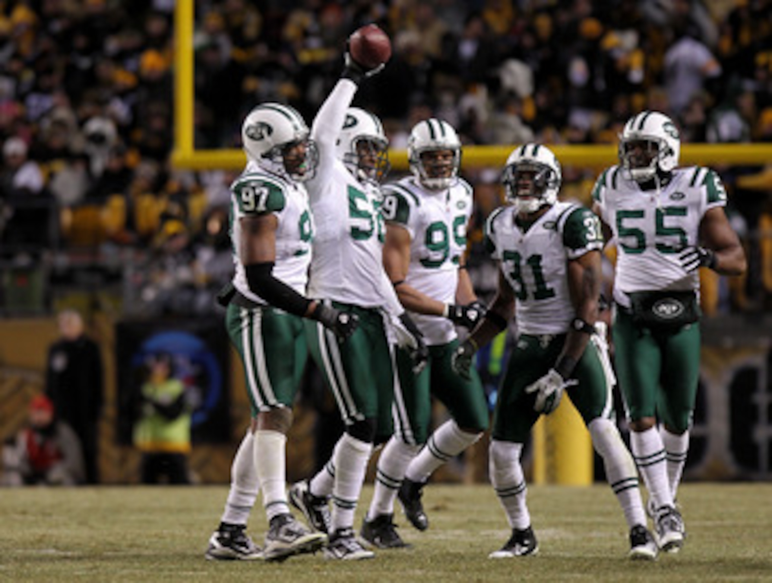 PITTSBURGH, PA - JANUARY 23:  (L-R) Calvin Pace #97, Bryan Thomas #58, Jason Taylor #99, Antonio Cromartie #31 and Jamaal Westerman #55 of the New York Jets celebrate after an interception by Thomas against the Pittsburgh Steelers during the 2011 AFC Cham