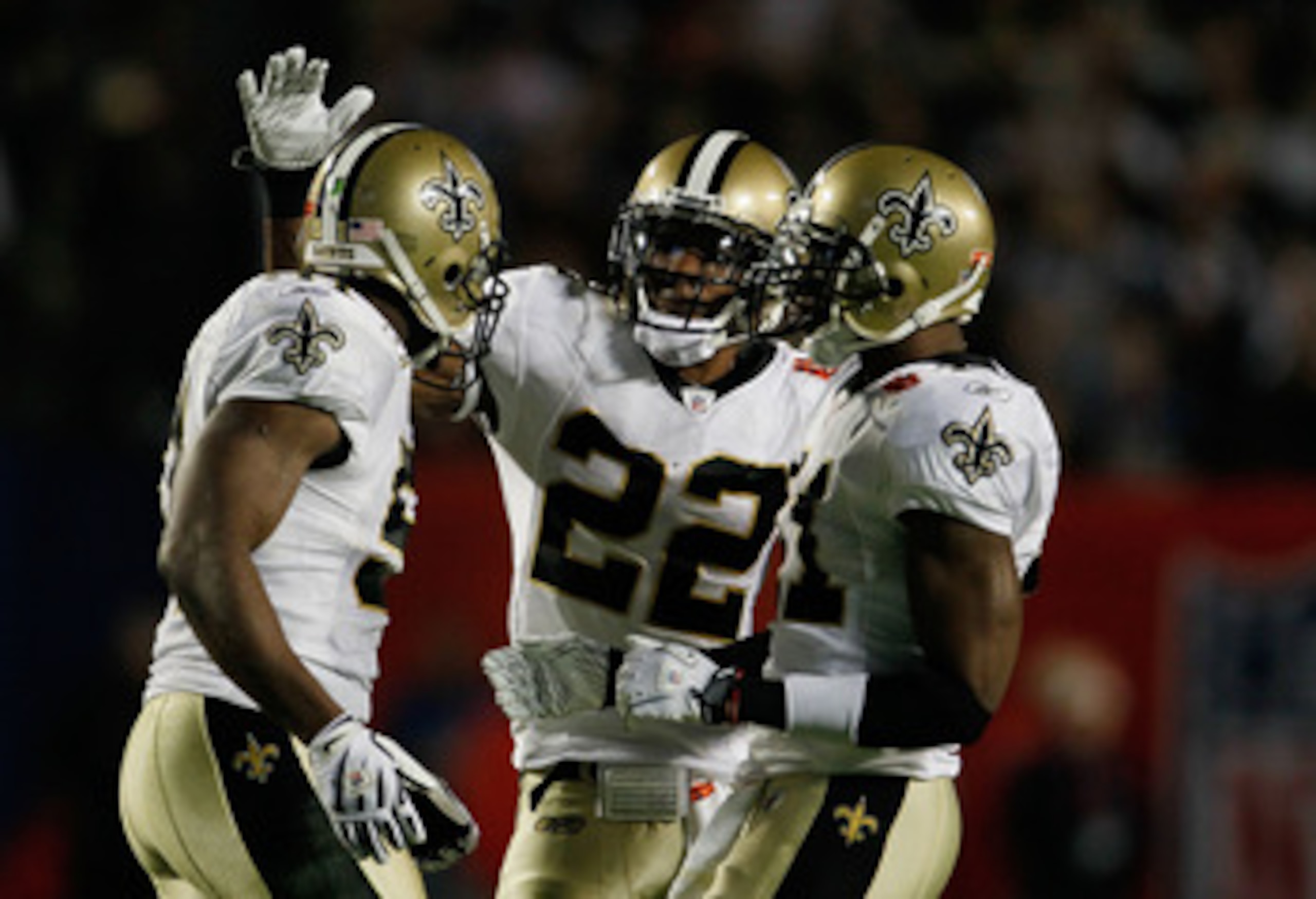 MIAMI GARDENS, FL - FEBRUARY 07:  Jonathan Vilma #51, Tracy Porter #22 and Roman Harper #41 of the New Orleans Saints celebrate after a play against the Indianapolis Colts during Super Bowl XLIV on February 7, 2010 at Sun Life Stadium in Miami Gardens, Fl