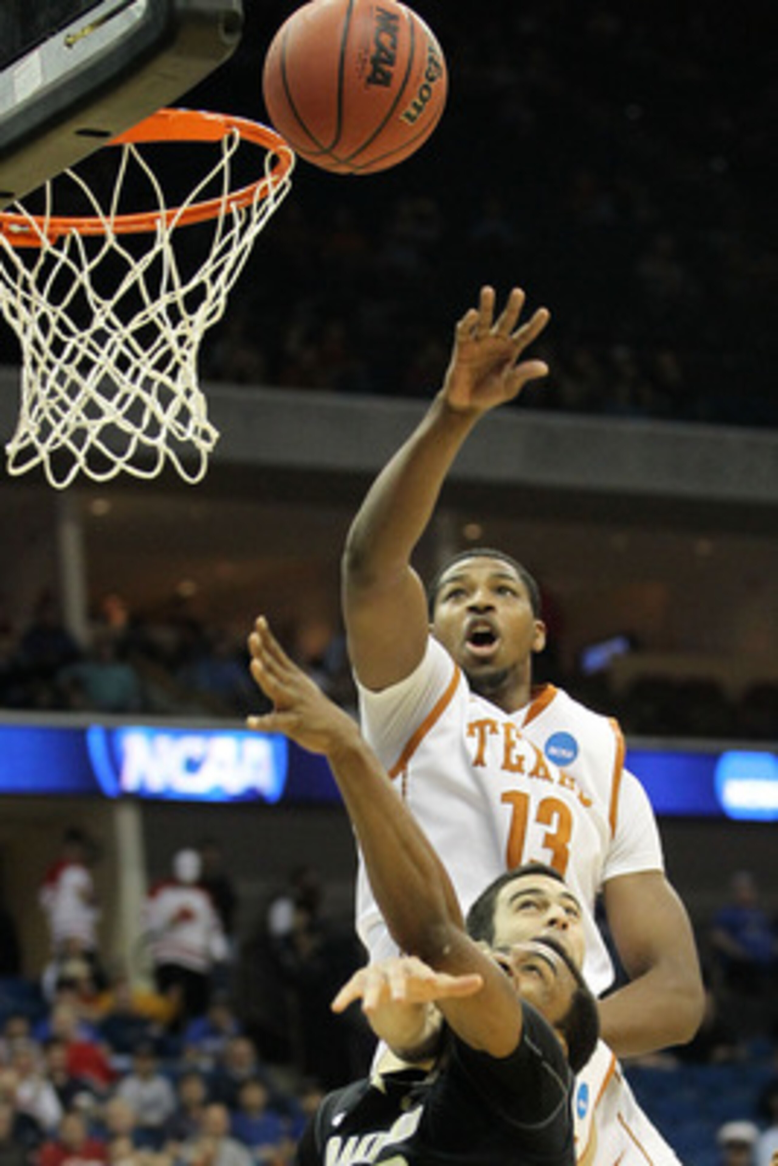 TULSA, OK - MARCH 18: Tristan Thompson #13 of the Texas Longhorns blocks a shot by Reggie Hamilton #23 of the Oakland Golden Grizzlies during the second round game of the 2011 NCAA men's basketball tournament at BOK Center on March 18, 2011 in Tulsa, Okl TULSA, OK - MARCH 18: Tristan Thompson #13 of the Texas Longhorns blocks a shot by Reggie Hamilton #23 of the Oakland Golden Grizzlies during the second round game of the 2011 NCAA men's basketball tournament at BOK Center on March 18, 2011 in Tulsa, Okl