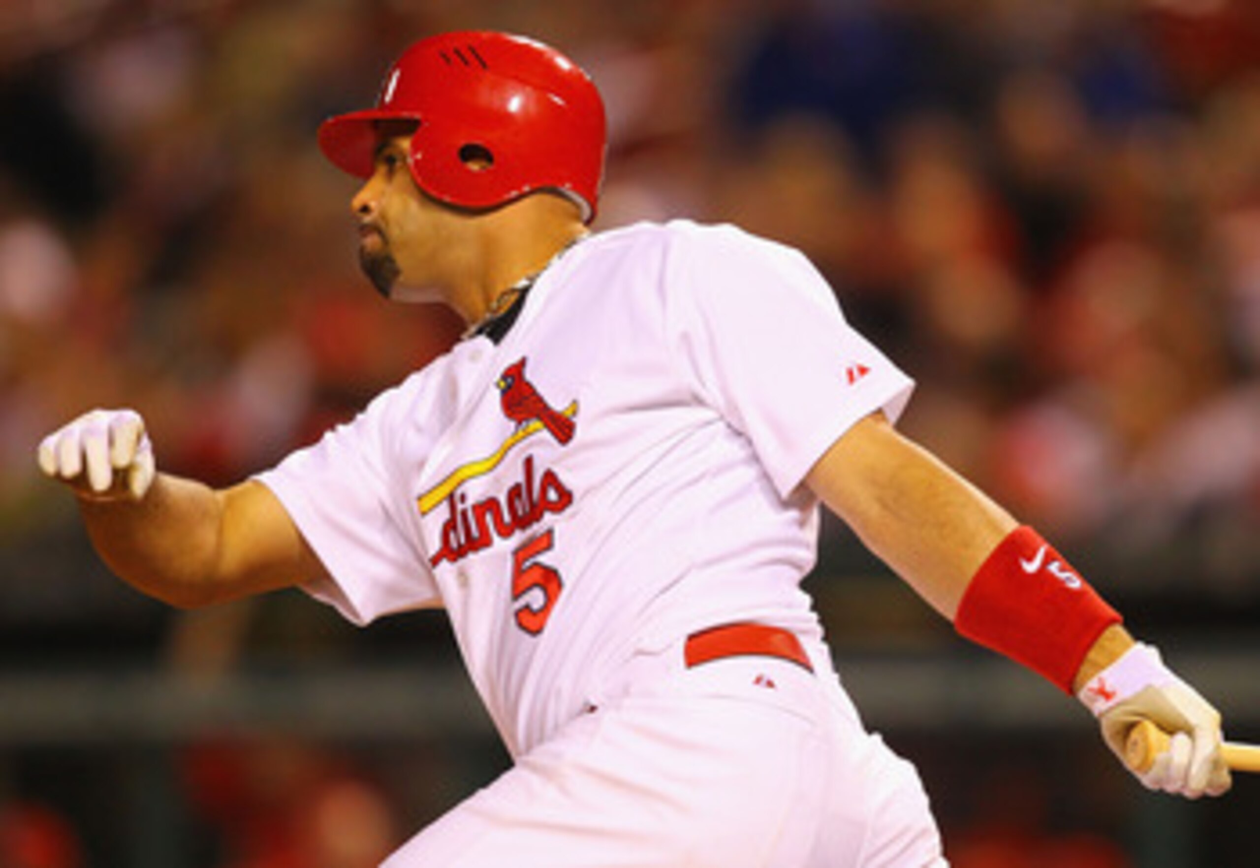 ST. LOUIS, MO - MAY 17: Albert Pujols #5 of the St. Louis Cardinals hits a single against the Philadelphia Phillies at Busch Stadium on May 17, 2011 in St. Louis, Missouri.  (Photo by Dilip Vishwanat/Getty Images)