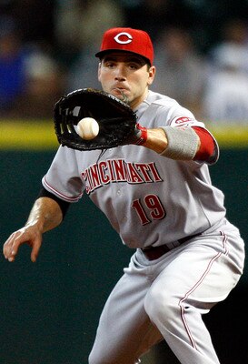 HOUSTON - MAY 11: First baseman Joey Votto #19 of the Cincinnati Reds fields a ground ball during  a baseball game against the Houston Astros at Minute Maid Park on May 11, 2011 in Houston, Texas.  (Photo by Bob Levey/Getty Images)