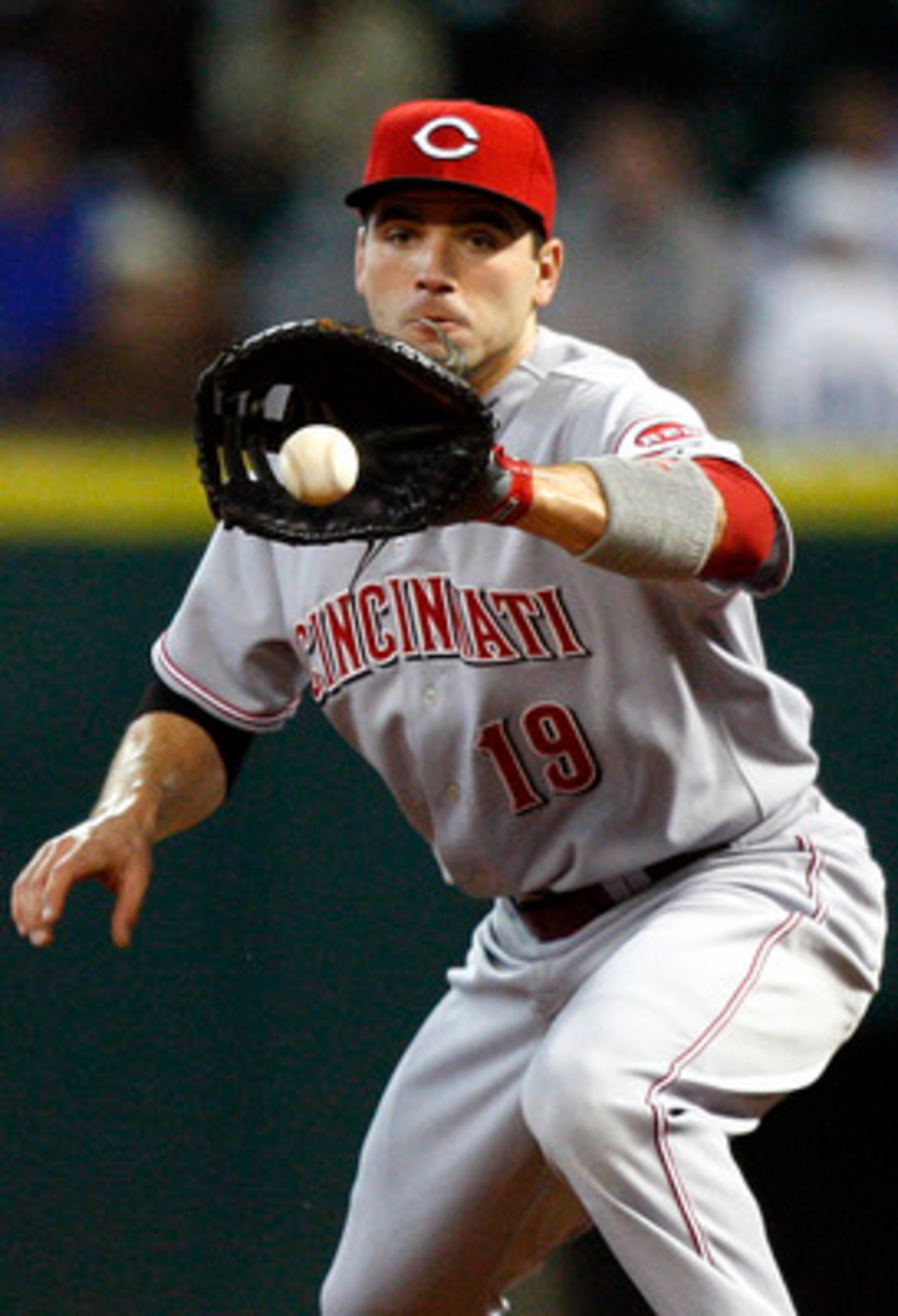 HOUSTON - MAY 11: First baseman Joey Votto #19 of the Cincinnati Reds fields a ground ball during  a baseball game against the Houston Astros at Minute Maid Park on May 11, 2011 in Houston, Texas.  (Photo by Bob Levey/Getty Images)