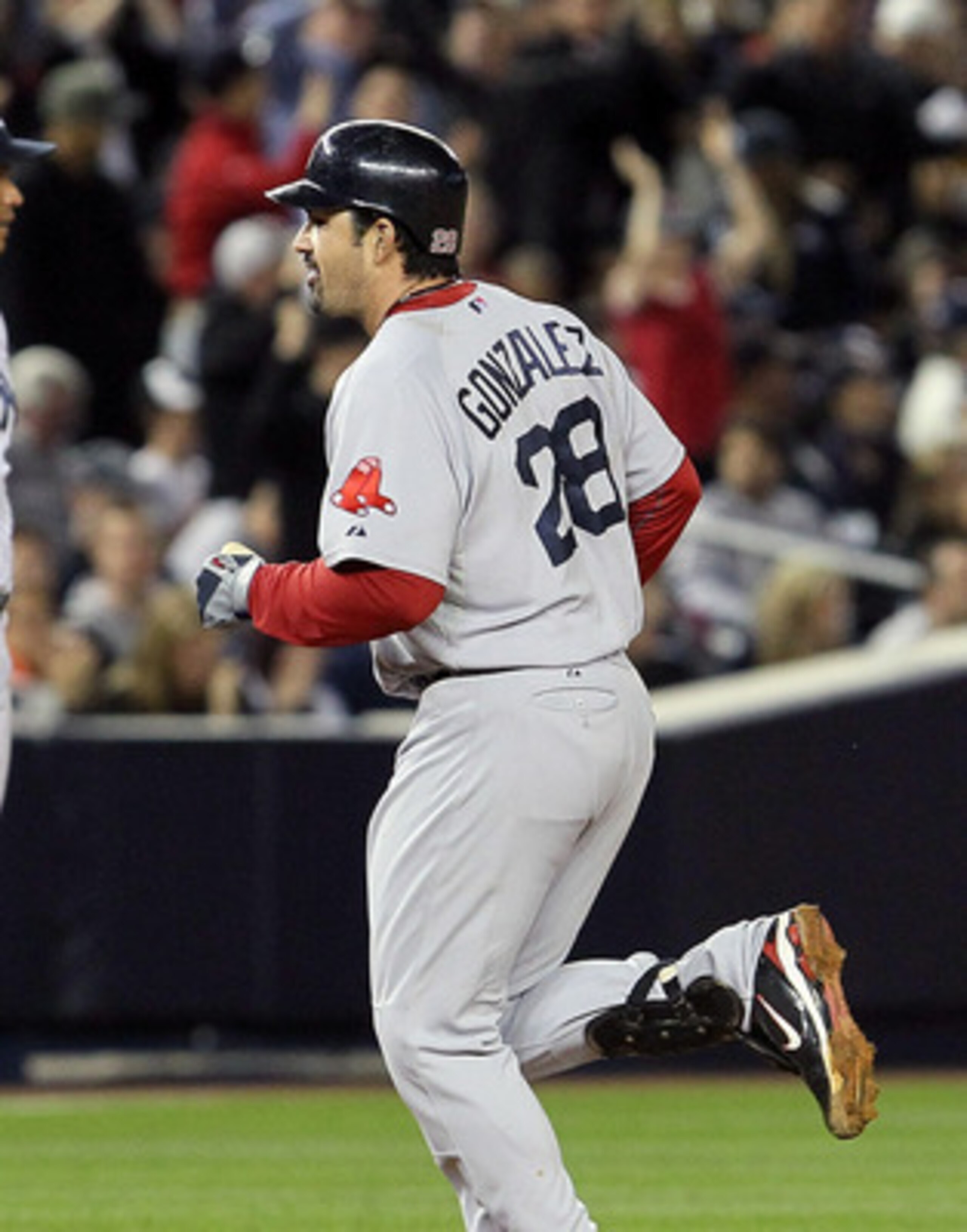 NEW YORK, NY - MAY 14:  Adrian Gonzalez #28 of the Boston Red Sox runs the bases after his seventh inning three run home run as Alex Rodiguez #13 of the New York Yankees looks on on May 14, 2011 at Yankee Stadium in the Bronx borough of New York City.  (P