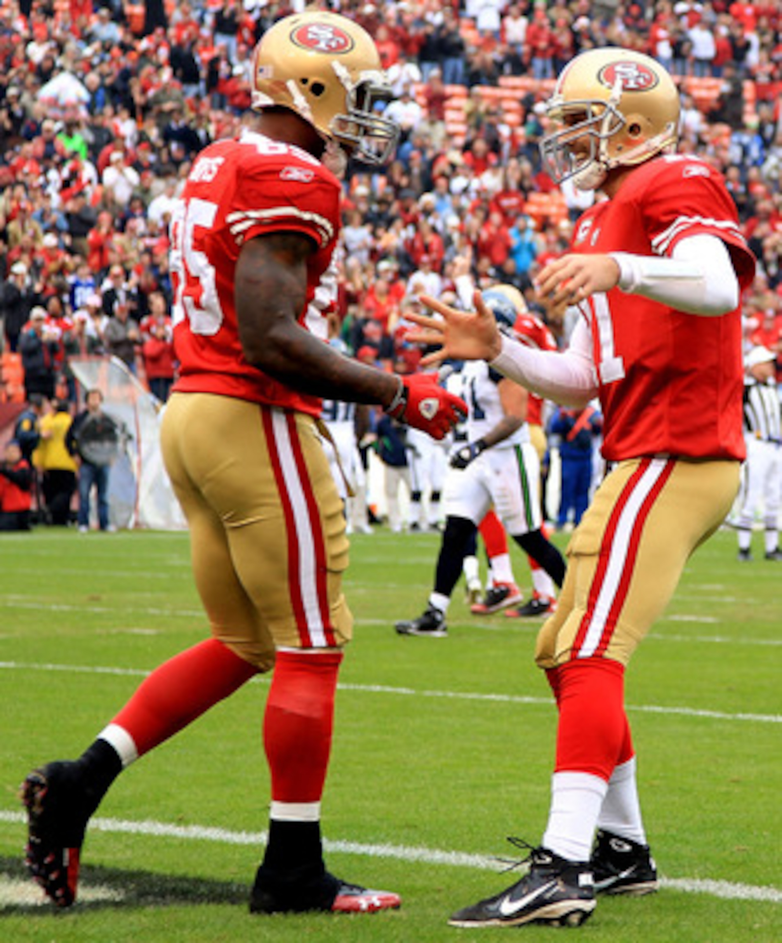 SAN FRANCISCO - DECEMBER 12:    Vernon Davis #85 of the San Francisco 49ers celebrates with Alex Smith #11 after a catching a touchdown against the Seattle Seahawks during an NFL game at Candlestick Park on December 12, 2010 in San Francisco, California.
