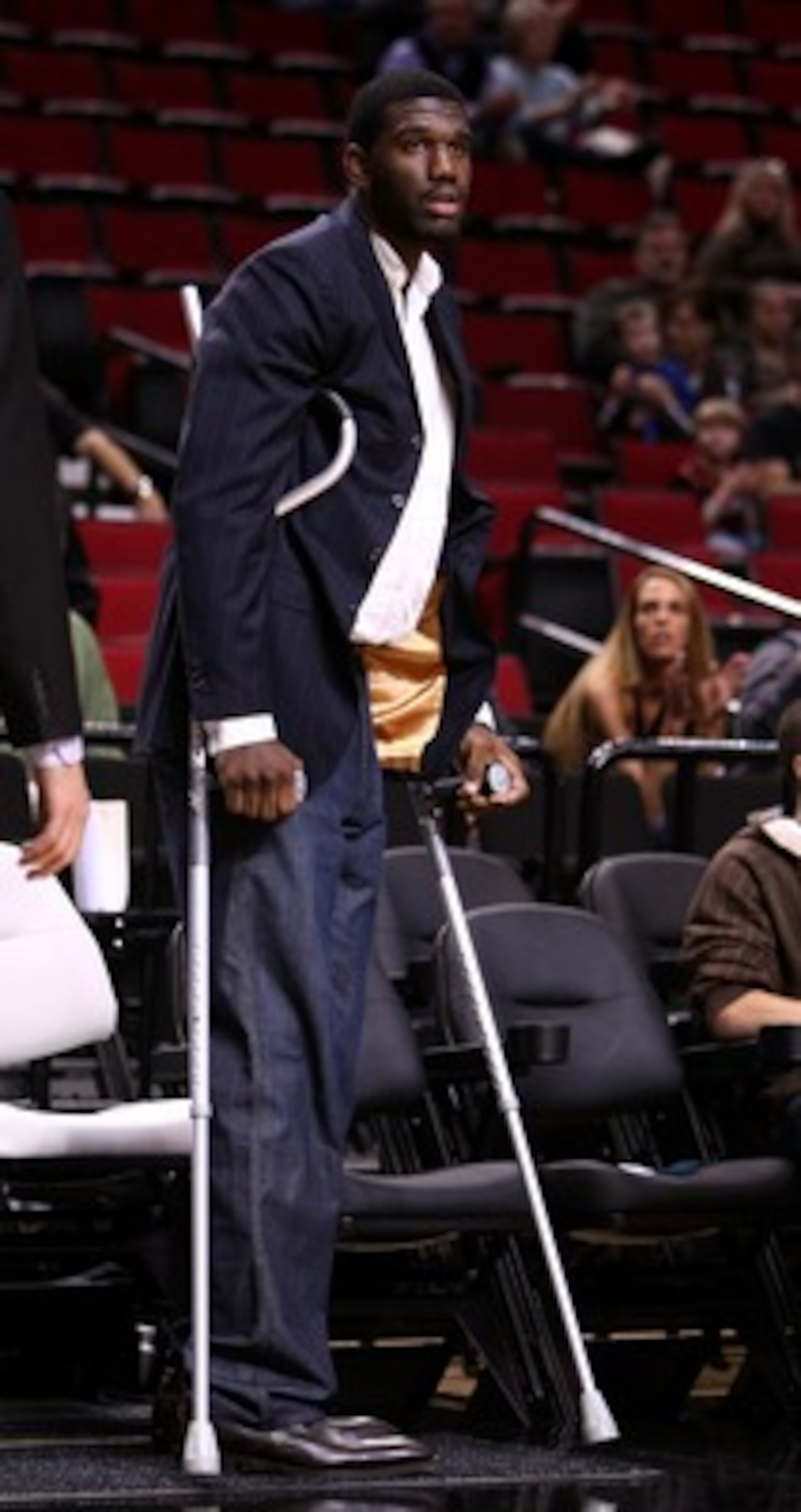PORTLAND, OR - OCTOBER 10:  Greg Oden #52 of the Portland Trail Blazers, who is out for the season after under going micro fracture surgery in his knee, sits on the bench to watch a pre-season game against the Los Angeles Clippers at the Rose Garden on Oc