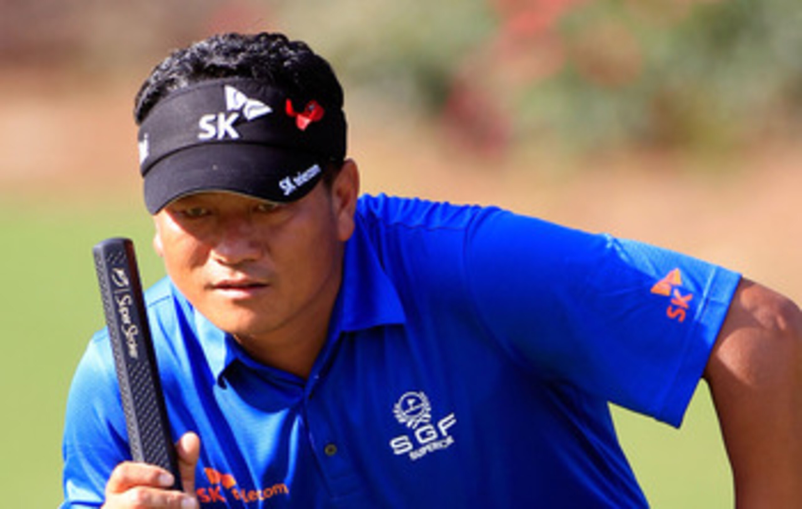 PONTE VEDRA BEACH, FL - MAY 15: K.J. Choi of South Korea lines up a putt on the 14th hole during the final round of THE PLAYERS Championship held at THE PLAYERS Stadium course at TPC Sawgrass on May 15, 2011 in Ponte Vedra Beach, Florida. (Photo by Sam PONTE VEDRA BEACH, FL - MAY 15: K.J. Choi of South Korea lines up a putt on the 14th hole during the final round of THE PLAYERS Championship held at THE PLAYERS Stadium course at TPC Sawgrass on May 15, 2011 in Ponte Vedra Beach, Florida. (Photo by Sam