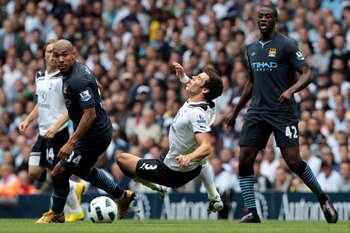 LONDON, ENGLAND - AUGUST 14:  Gareth Bale of Tottenham and Nigel De Jong of Manchester City in action during the Barclays Premier League match between Tottenham Hotspur and Manchester City at White Hart Lane on August 14, 2010 in London, England.  (Photo 