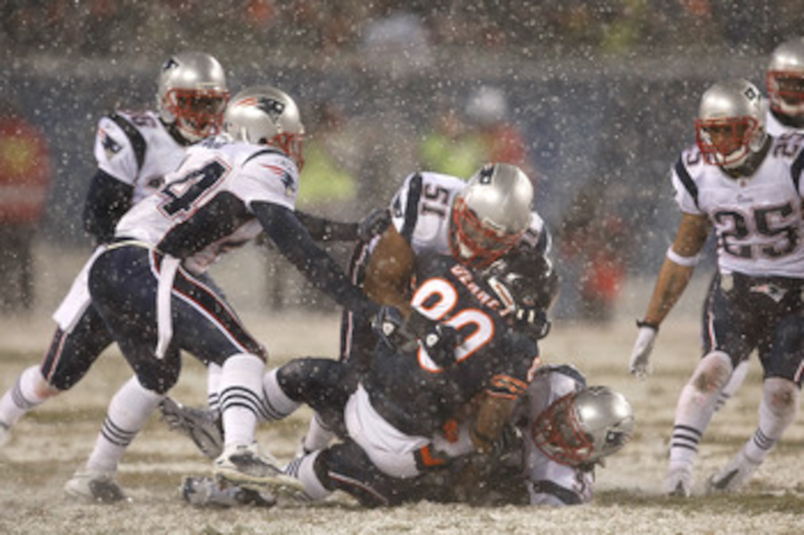 CHICAGO, IL - DECEMBER 12: Jerod Mayo #51 of the New England Patriots tackles Earl Bennett #80 of the Chicago Bears at Soldier Field on December 12, 2010 in Chicago, Illinois. The Patriots defeated the Bears 36-7. (Photo by Scott Boehm/Getty Images)