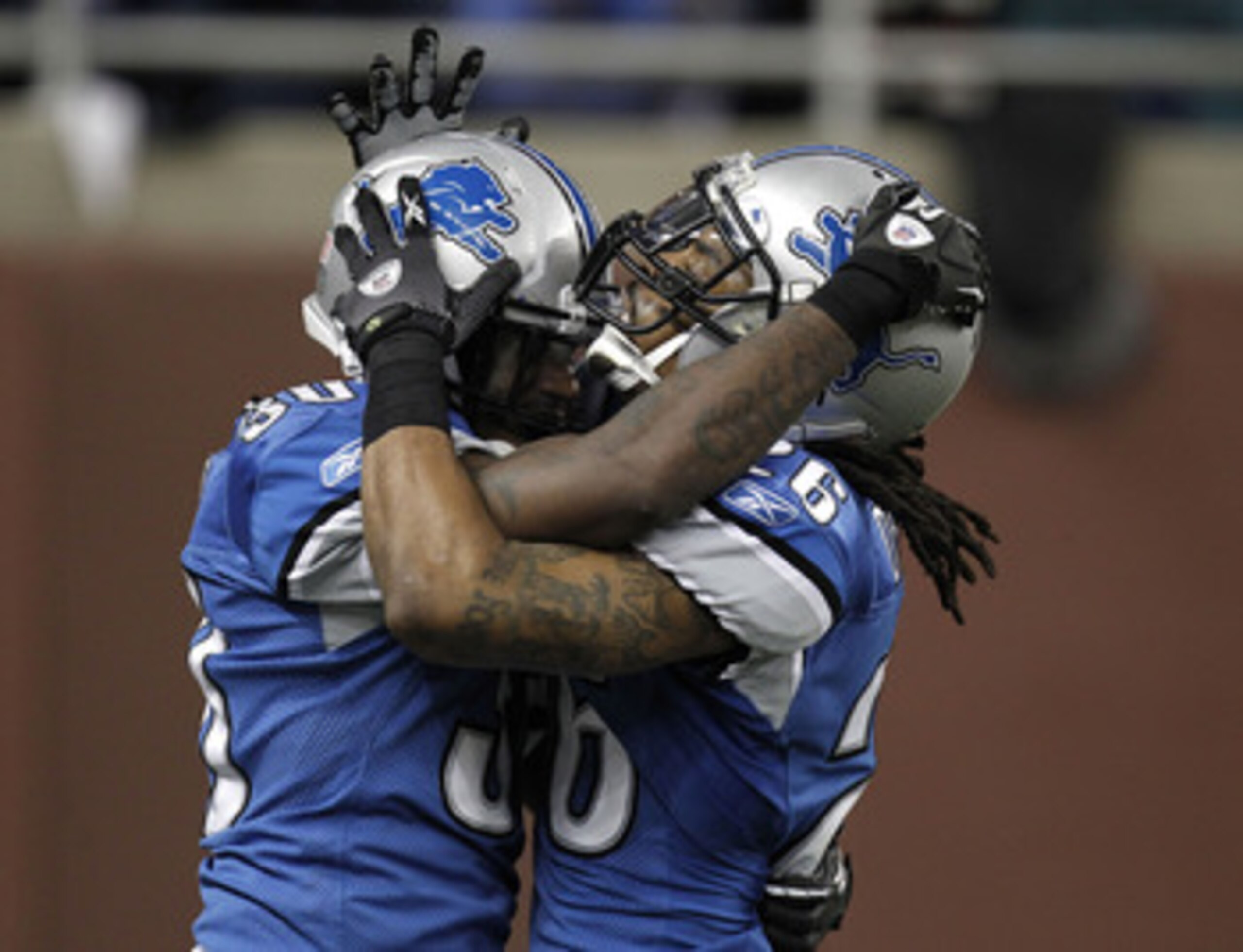 DETROIT, MI - DECEMBER 12:  Louis Delmas #26 of the Detroit Lions celebrates with Nathan Vasher #30 after a fourth down incomplete pass by the Green Bay Packers on December 12, 2010 at Ford Field in Detroit, Michigan. Detroit won the game 7-3  (Photo by G