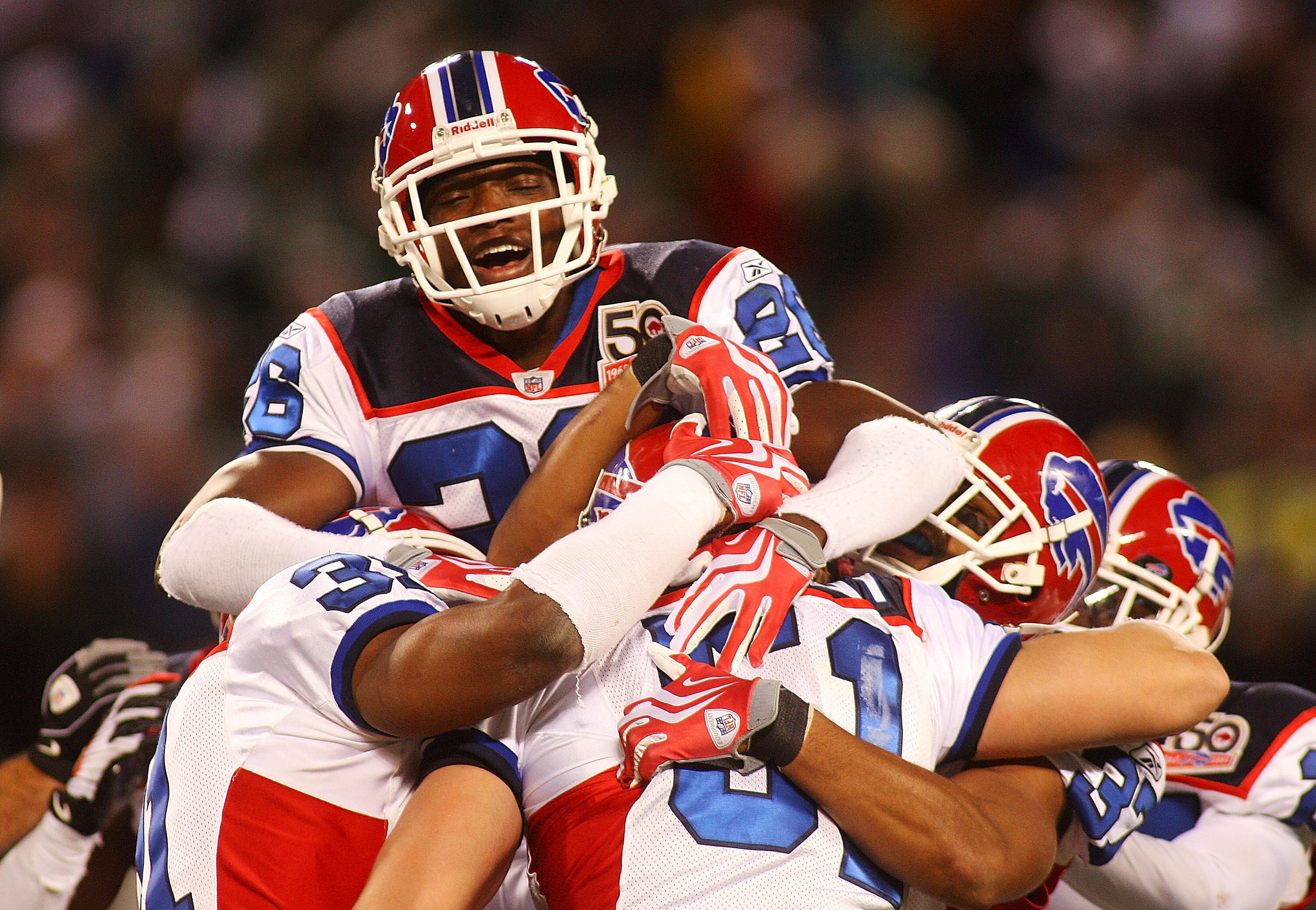 EAST RUTHERFORD, NJ - OCTOBER 18:  Paul Posluszny #51 of the Buffalo Bills is congradulated by teammate Ashton Youboty #26 after intercepting the ball in overtime against the New York Jets at Giants Stadium in the Meadowlands on October 18, 2009 in East R
