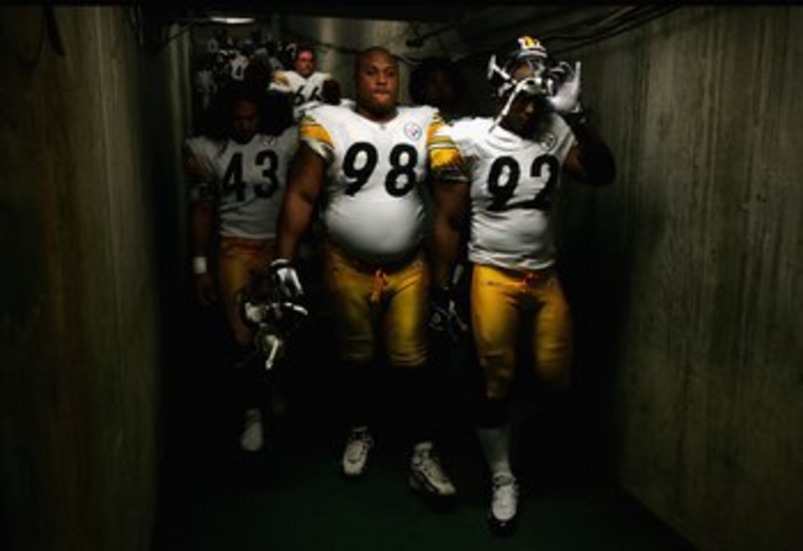 SAN DIEGO - OCTOBER 08:  Troy Polamalu #43, Casey Hampton #98, and James Harrison #92 of the Pittsburgh Steelers enter the game against the San Diego Chargers during the 1st half of their NFL game on October 8, 2006 at Qualcomm Stadium in San Diego, Calif