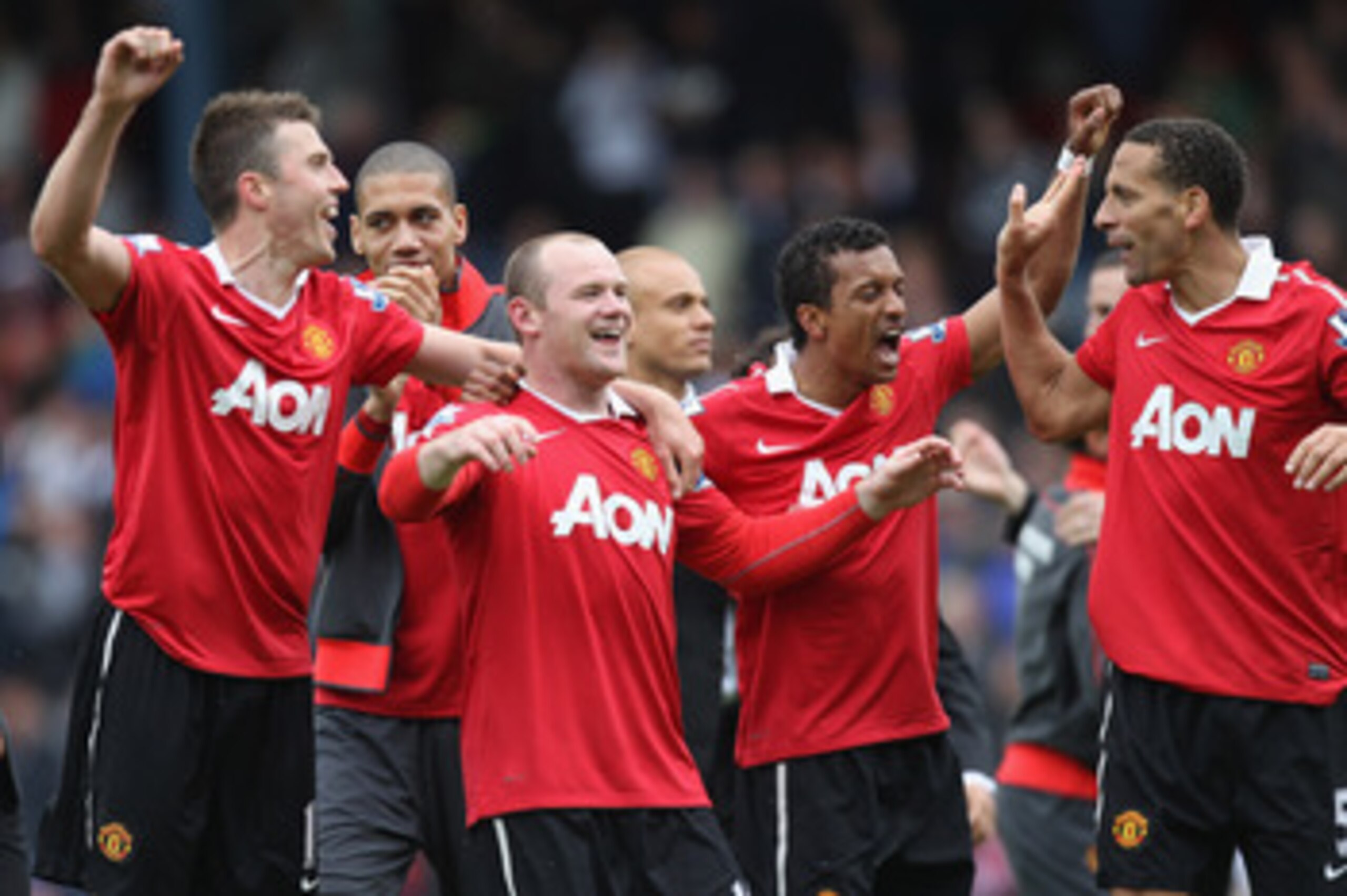 BLACKBURN, ENGLAND - MAY 14:  Michael Carrick (L),Chris Smalling (2L),Wayne Rooney (3L), Nani (2R) and Rio Ferdinand of Manchester United celebrate clinching the title during the Barclays Premier League match between Blackburn Rovers and Manchester United