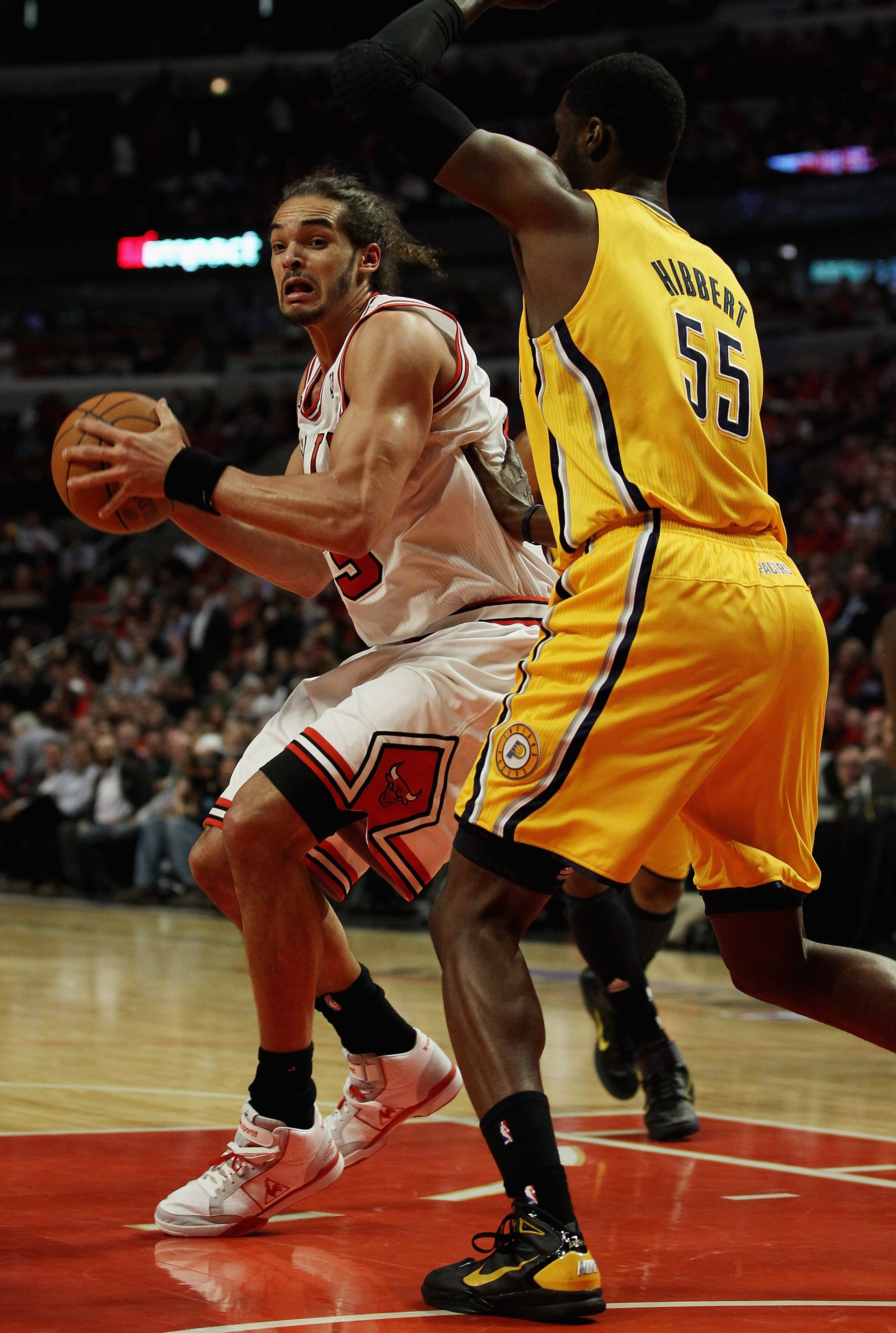 CHICAGO, IL - APRIL 26: Joakim Noah #13 of the Chicago Bulls moves against Roy Hibbert #55 of the Indiana Pacers in Game Five of the Eastern Conference Quarterfinals in the 2011 NBA Playoffs at the United Center on April 26, 2011 in Chicago, Illinois. The