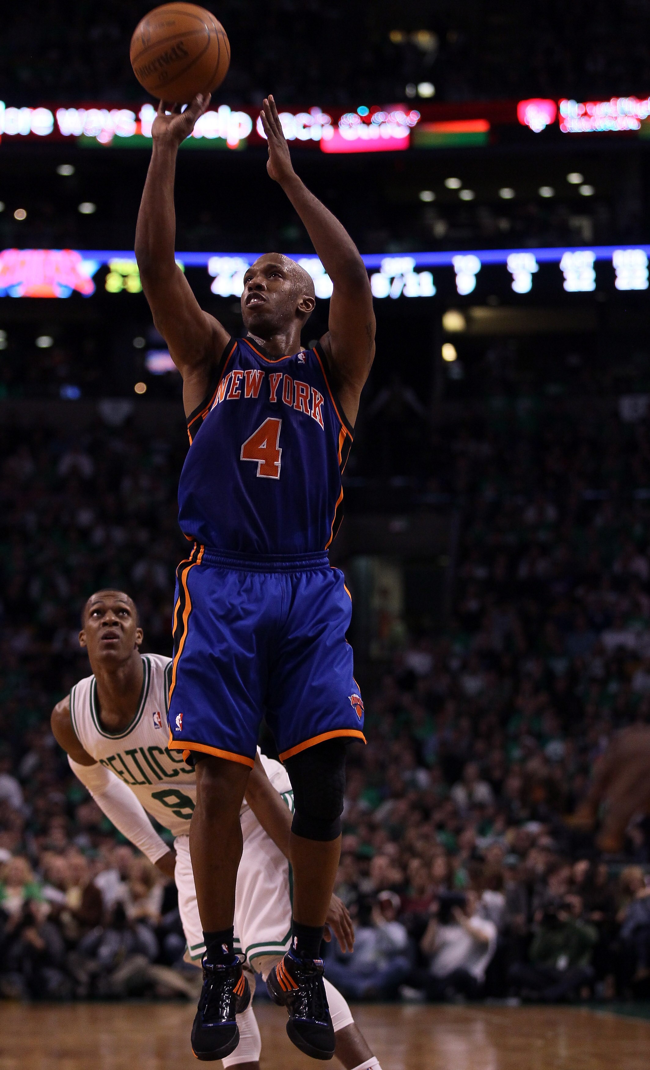 BOSTON, MA - APRIL 17:  Chauncey Billups #4 of the New York Knicks takes a shot as Rajon Rondo #9 of the Boston Celtics defends in Game One of the Eastern Conference Quarterfinals in the 2011 NBA Playoffs on April 17, 2011 at the TD Garden in Boston, Mass