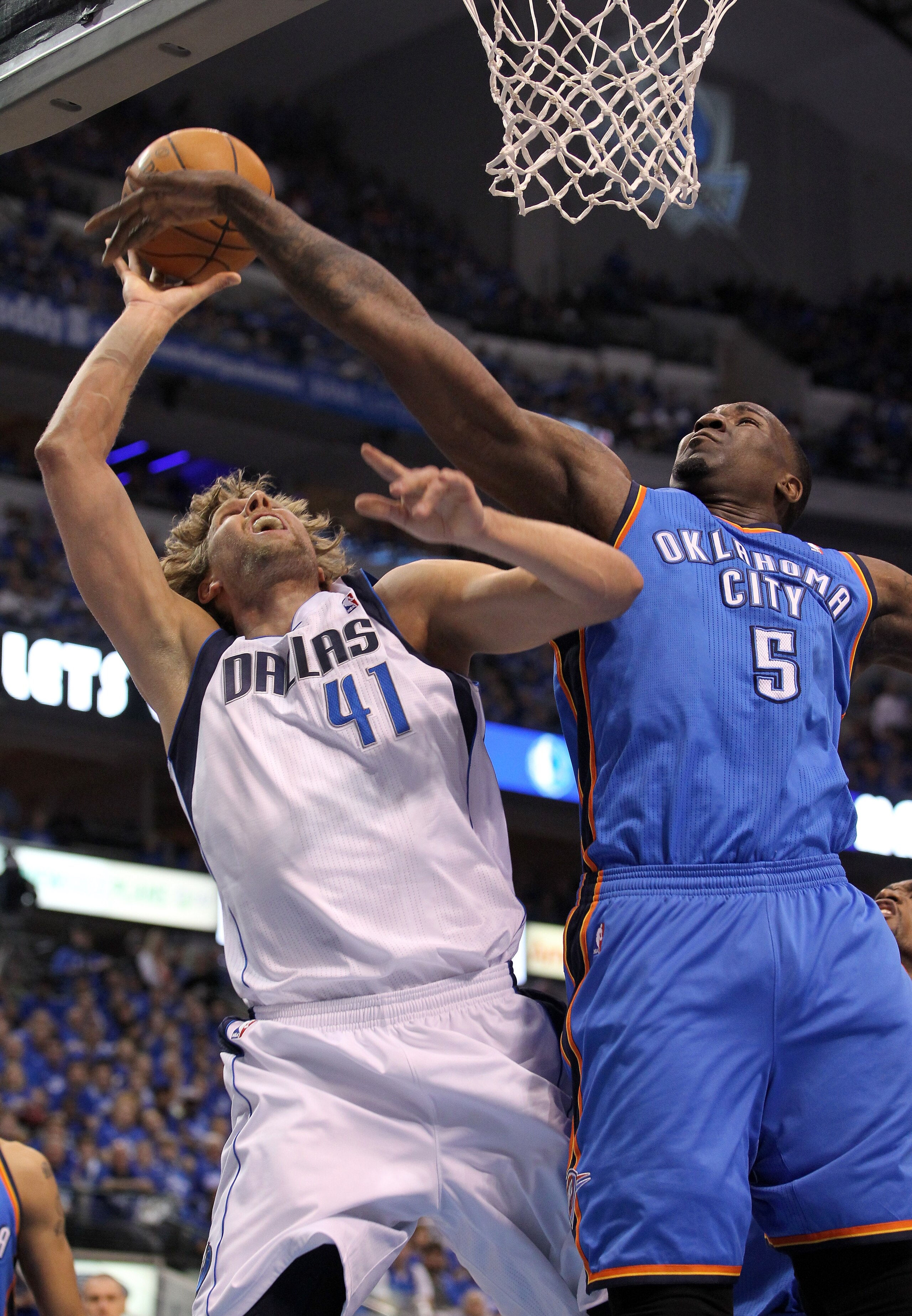 DALLAS, TX - MAY 17:  Dirk Nowitzki #41 of the Dallas Mavericks goes up for a shot against Kendrick Perkins #5 of the Oklahoma City Thunder in the first quarter in Game One of the Western Conference Finals during the 2011 NBA Playoffs at American Airlines