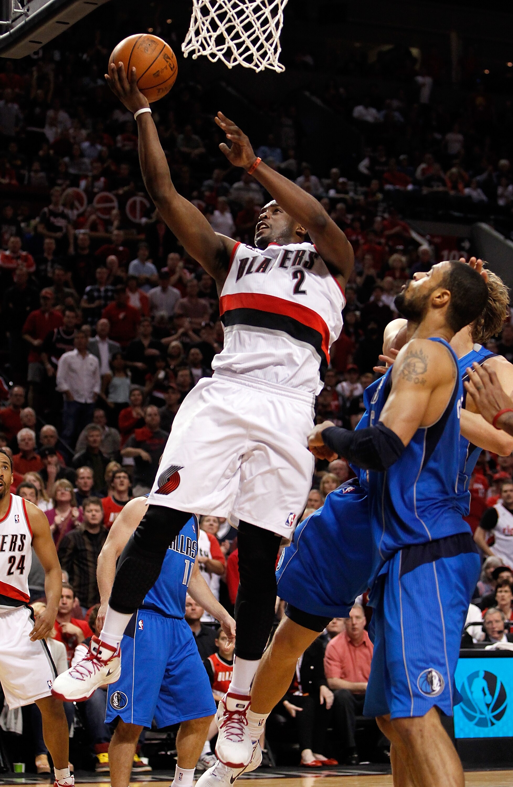 PORTLAND, OR - APRIL 23:  Wesley Matthews #2 of the Portland Trail Blazers lays up the ball against the Dallas Mavericks in Game Four of the Western Conference Quarterfinals in the 2011 NBA Playoffs on April 23, 2011 at the Rose Garden in Portland, Oregon