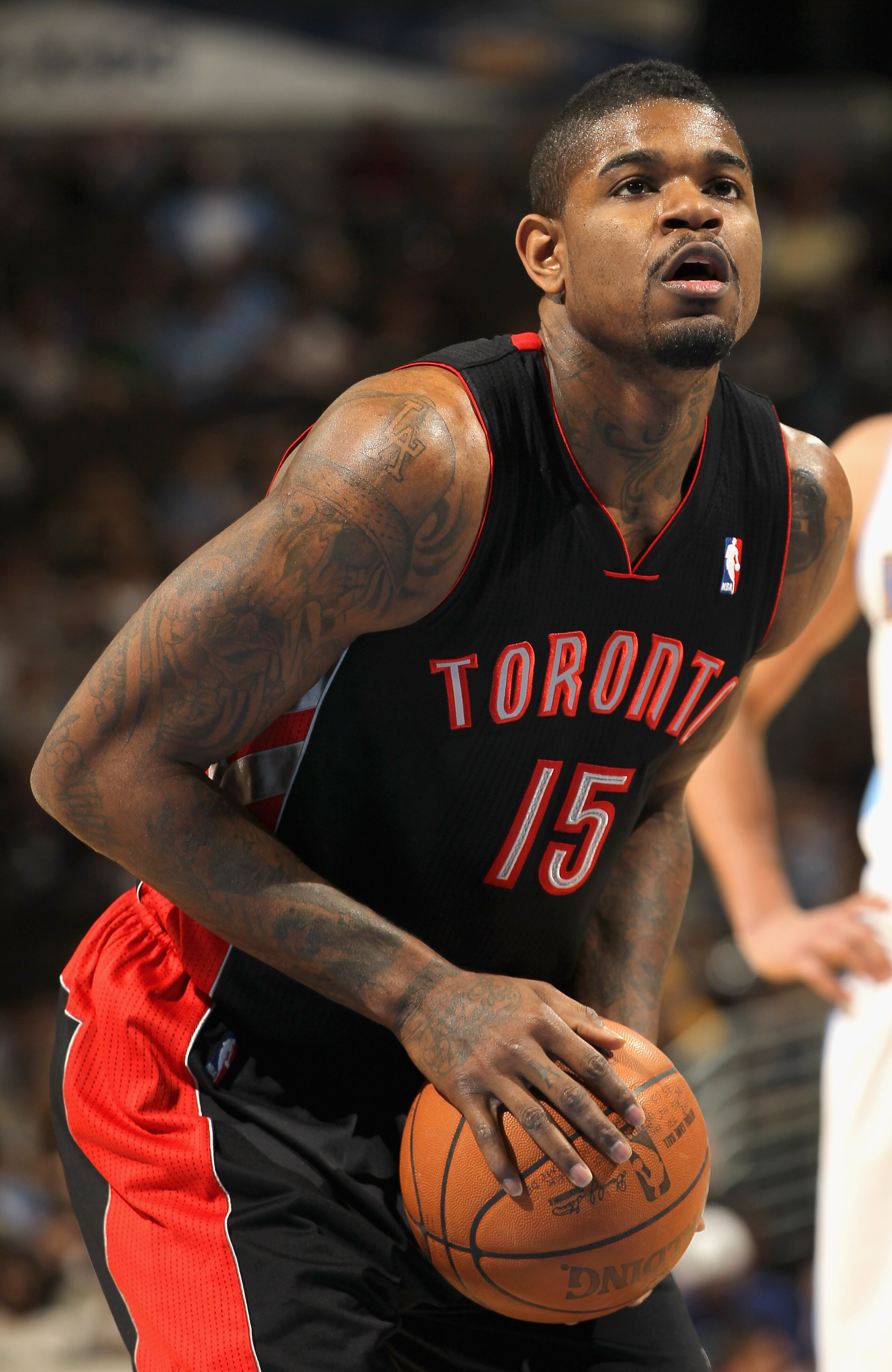 DENVER, CO - MARCH 21:  Amir Johnson #15 of the Toronto Raptors prepares to take a free throw against the Denver Nuggets at the Pepsi Center on March 21, 2011 in Denver, Colorado. The Nuggets defeated the Raptors 123-90. NOTE TO USER: User expressly ackno