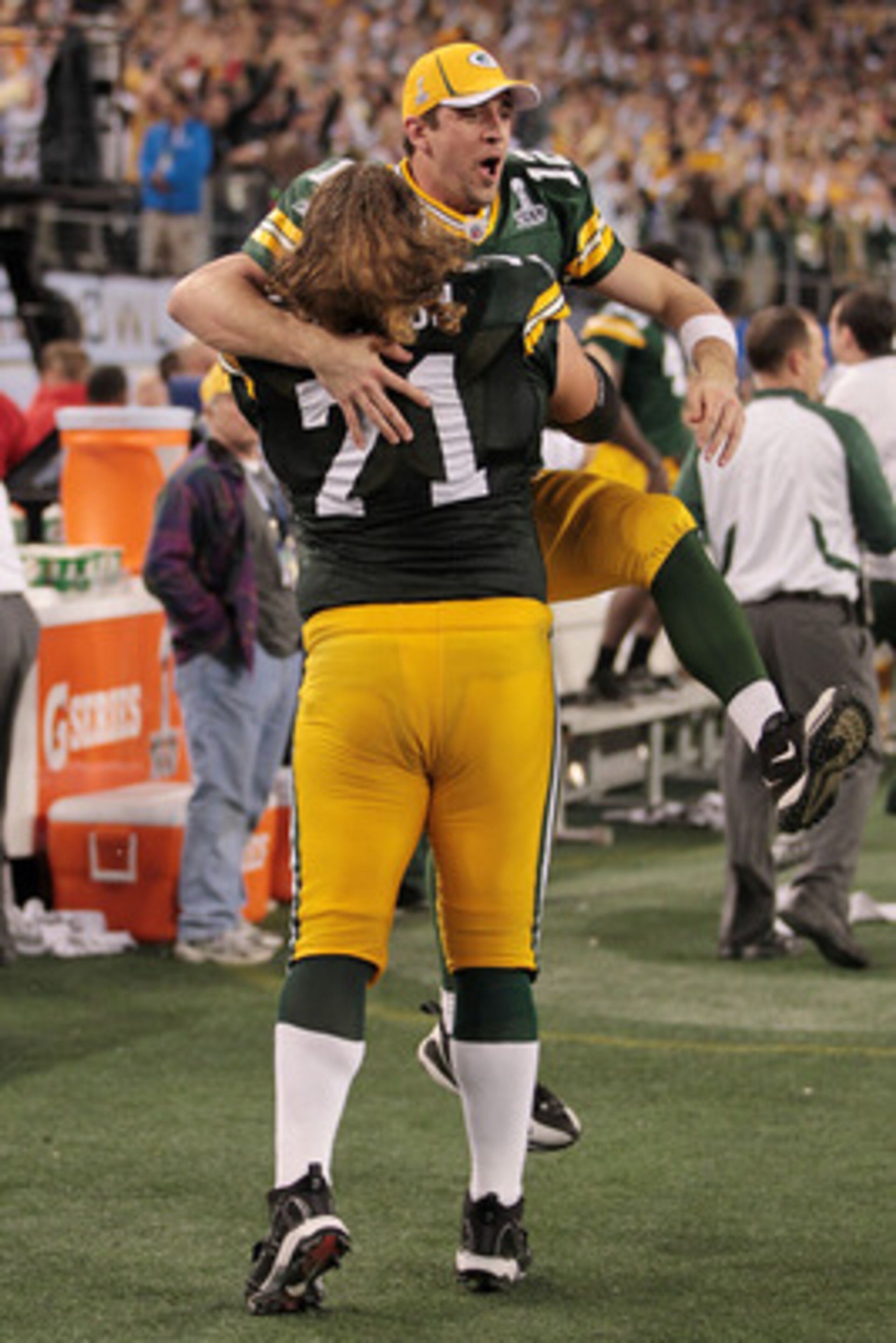 ARLINGTON, TX - FEBRUARY 06:  Aaron Rodgers #12 and Josh Sitton #71 of the Green Bay Packers celebrate after they defeated the Pittsburgh Steelers 31 to 25 in Super Bowl XLV at Cowboys Stadium on February 6, 2011 in Arlington, Texas.  (Photo by Jamie Squi