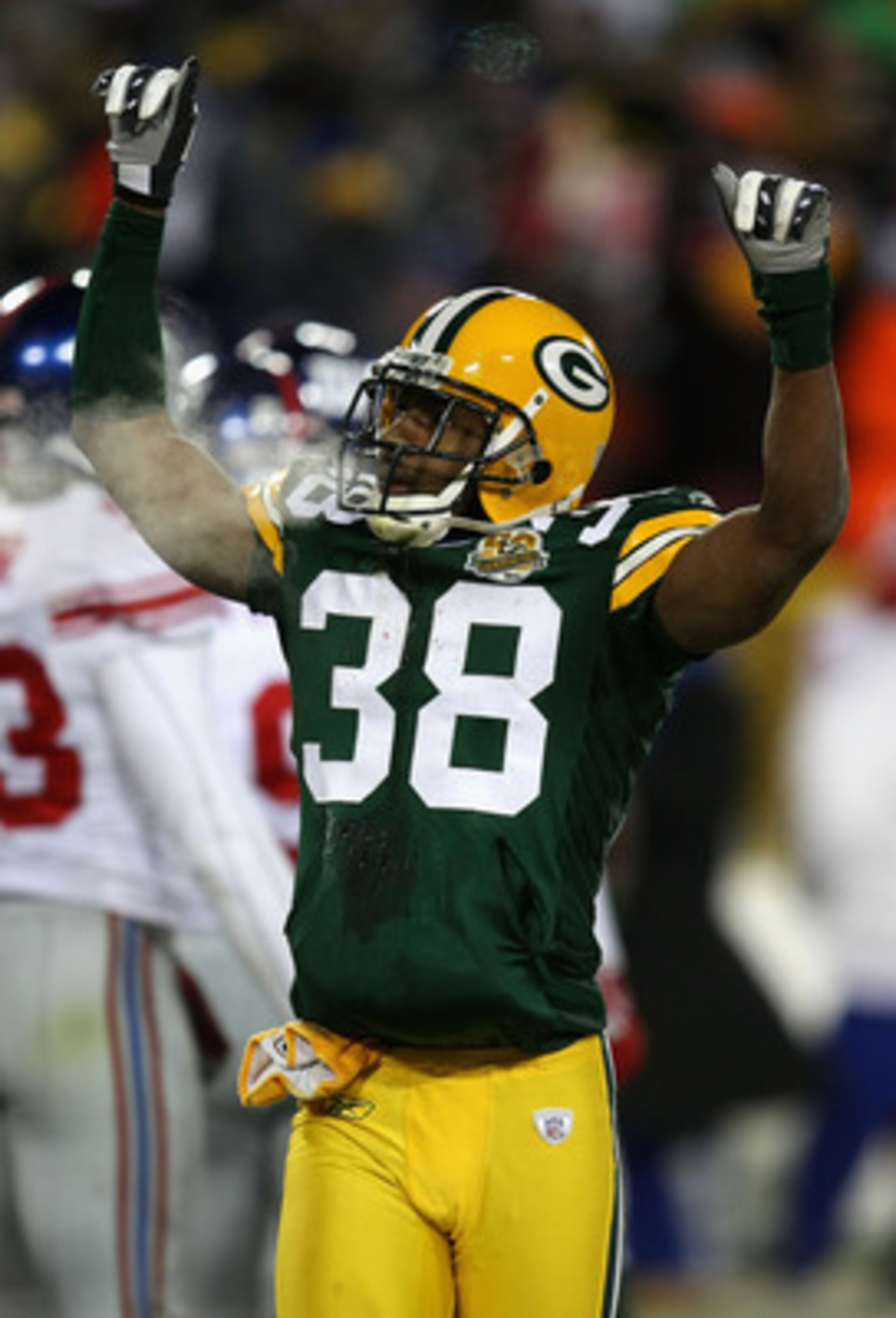 GREEN BAY, WI - JANUARY 20:  Tramon Williams #38 of the Green Bay Packers celebrates after kicker Lawrence Tynes #9 of the New York Giants missed a 36-yard field goal to end regulation during the NFC championship game on January 20, 2008 at Lambeau Field