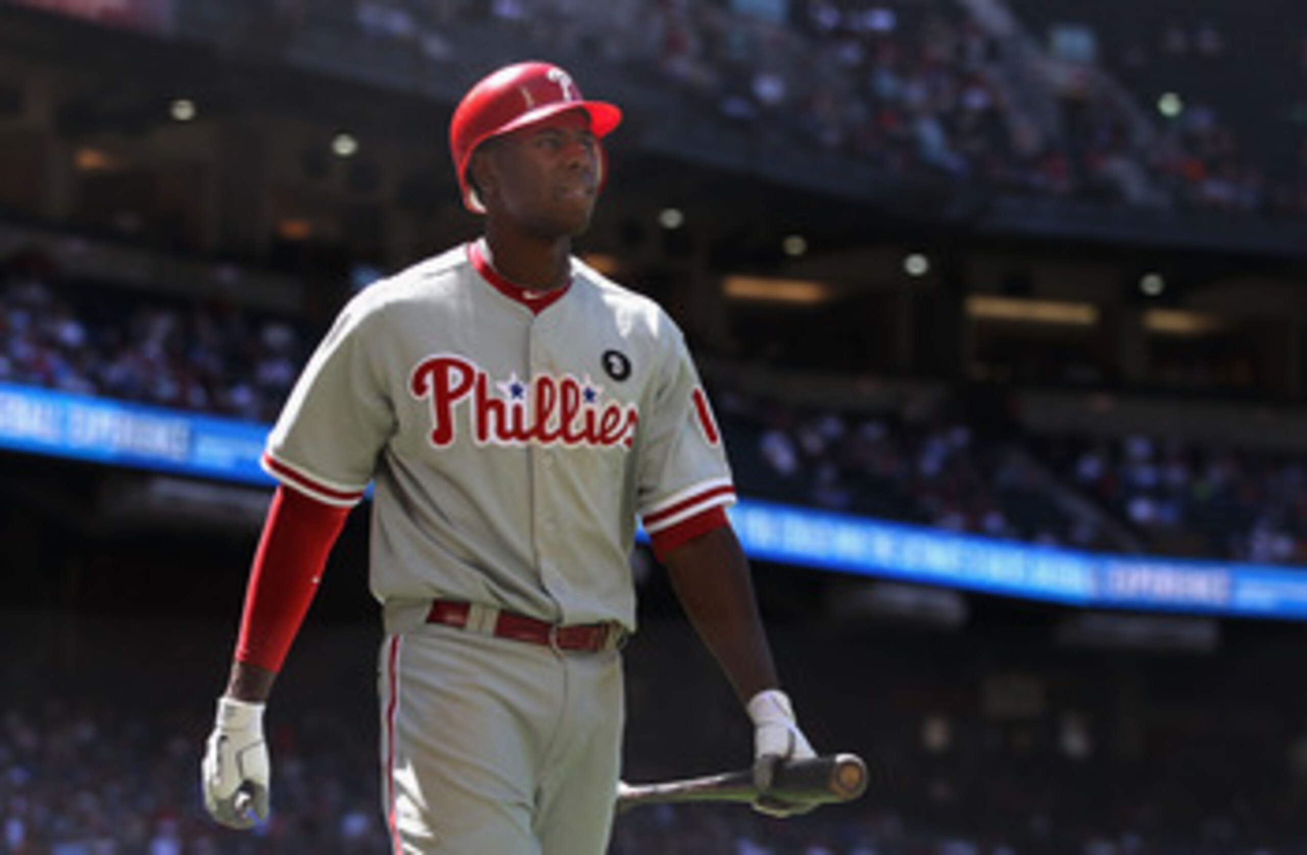PHOENIX, AZ - APRIL 27:  John Mayberry #15 of the Philadelphia Phillies walks to the dugout after striking out against the Arizona Diamondbacks during the Major League Baseball game at Chase Field on April 27, 2011 in Phoenix, Arizona. The Phillies defeat
