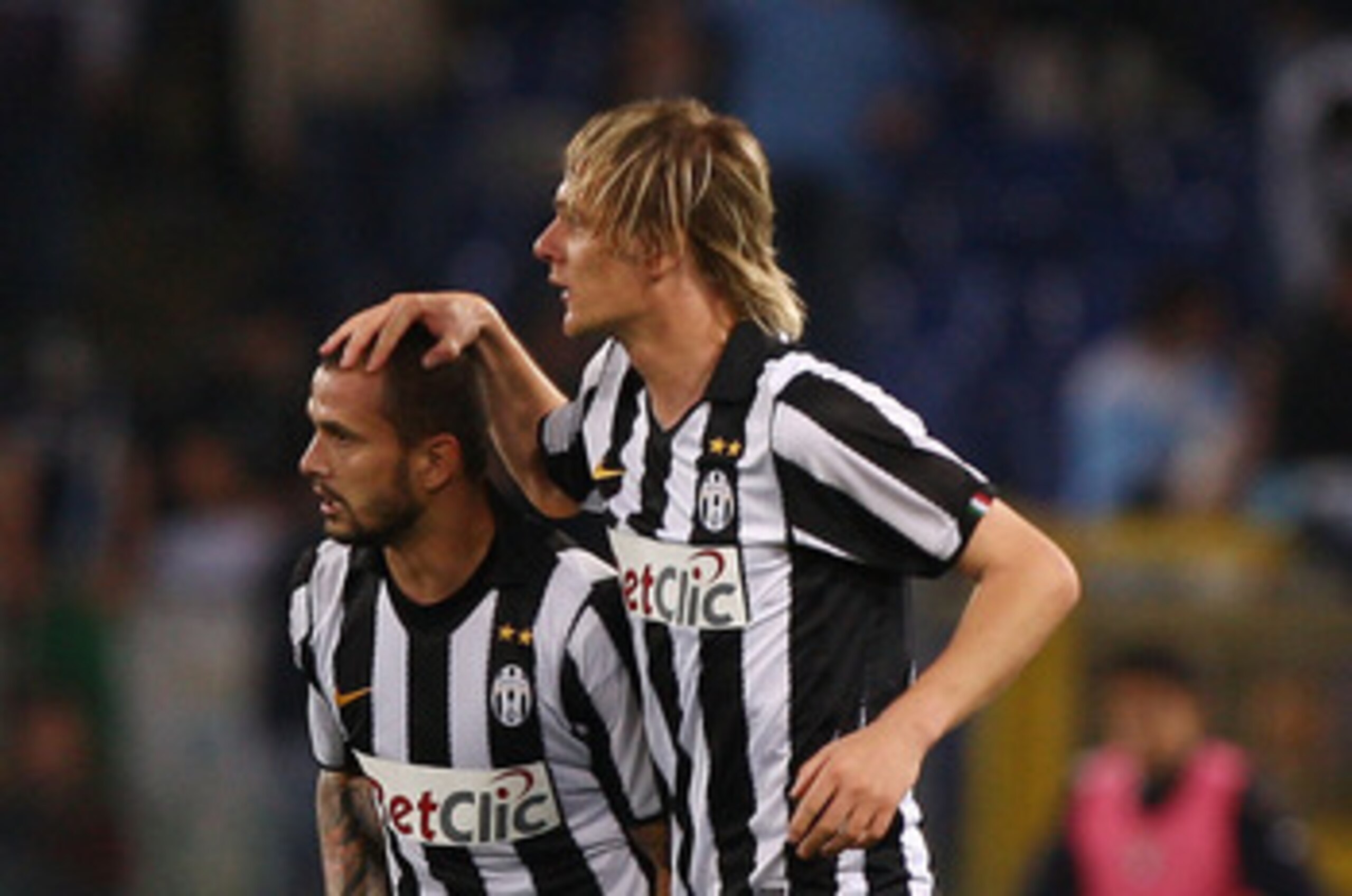 ROME, ITALY - MAY 02:  Simone Pepe (L) with his teammate Milos Krasic of  Juventus FC celebrates after scoring the opening goal during the Serie A match between SS Lazio and Juventus FC at Stadio Olimpico on May 2, 2011 in Rome, Italy.  (Photo by Paolo Br