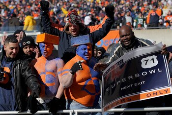 CHICAGO, IL - JANUARY 23:  Chicago Bears fans cheer from their seat before the Bears take on the Green Bay Packers in the NFC Championship Game at Soldier Field on January 23, 2011 in Chicago, Illinois.  (Photo by Doug Pensinger/Getty Images)