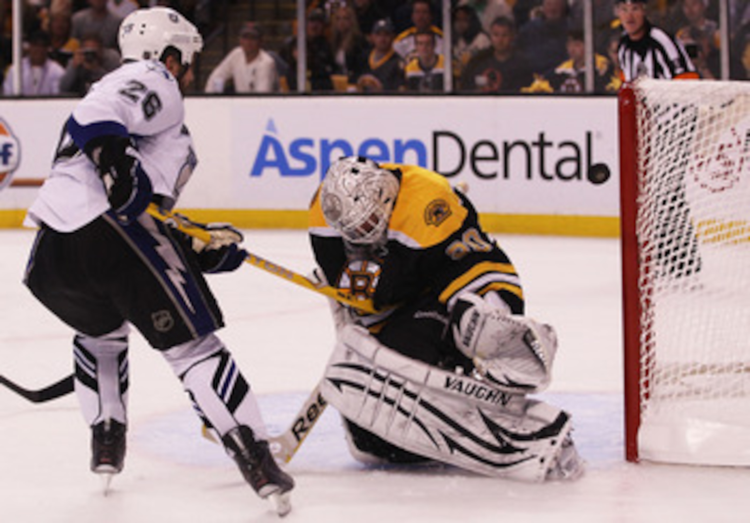 BOSTON, MA - MAY 14:  Tim Thomas #30 of the Boston Bruins blocks a shot by Martin St. Louis #26 of the Tampa Bay Lightning in the second period of Game One of the Eastern Conference Finals during the 2011 NHL Stanley Cup Playoffs at TD Garden on May 14, 2