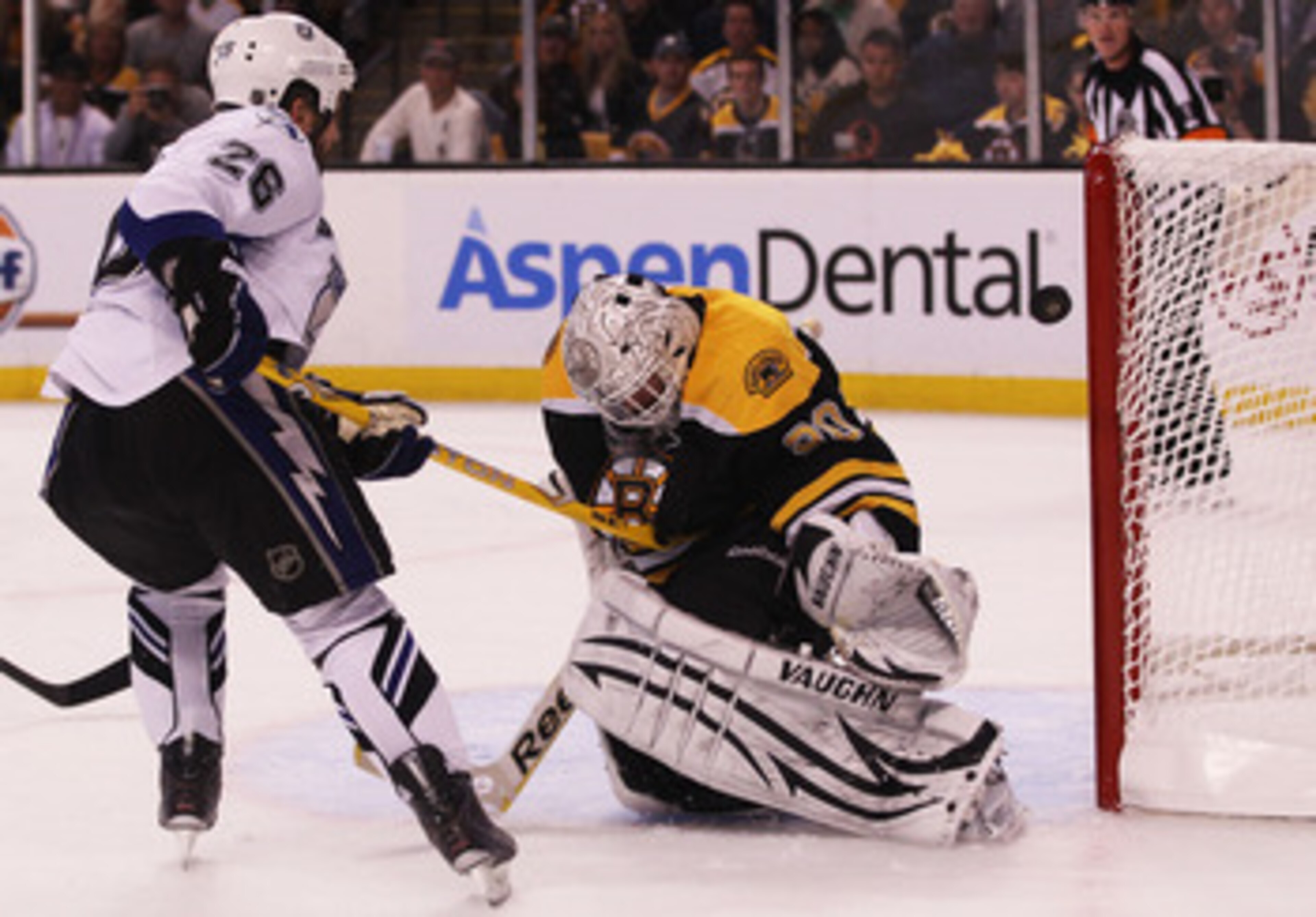 BOSTON, MA - MAY 14:  Tim Thomas #30 of the Boston Bruins blocks a shot by Martin St. Louis #26 of the Tampa Bay Lightning in the second period of Game One of the Eastern Conference Finals during the 2011 NHL Stanley Cup Playoffs at TD Garden on May 14, 2