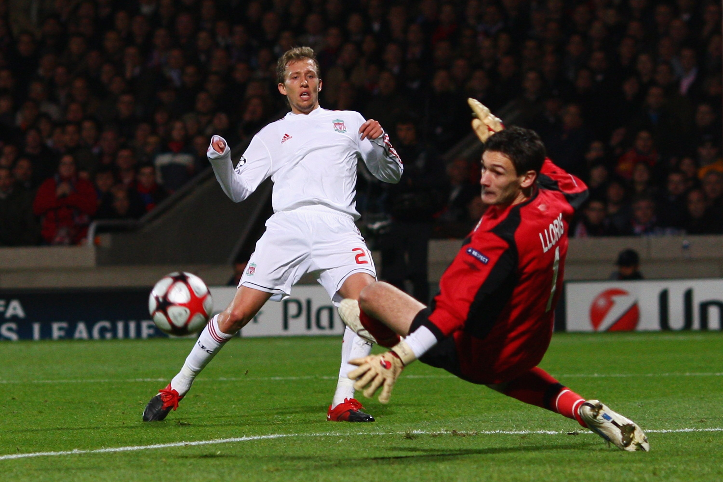 LYON, FRANCE - NOVEMBER 04:  Lucas (L) of Liverpool has his shot saved by Hugo Lloris (r) of Lyon during the Lyon v Liverpool UEFA Champions League Group E match at the Stade de Gerland on November 4, 2009 in Lyon, France.  (Photo by Michael Steele/Getty