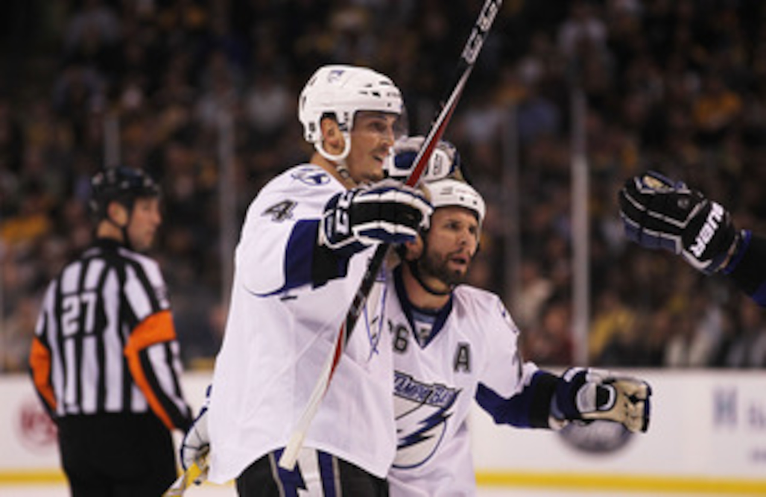 BOSTON, MA - MAY 17:  Vincent Lecavalier #4 celebrates with Martin St. Louis #26 of the Tampa Bay Lightning after Lecavalier scored a second period power play goal against the Boston Bruins in Game Two of the Eastern Conference Finals during the 2011 NHL 