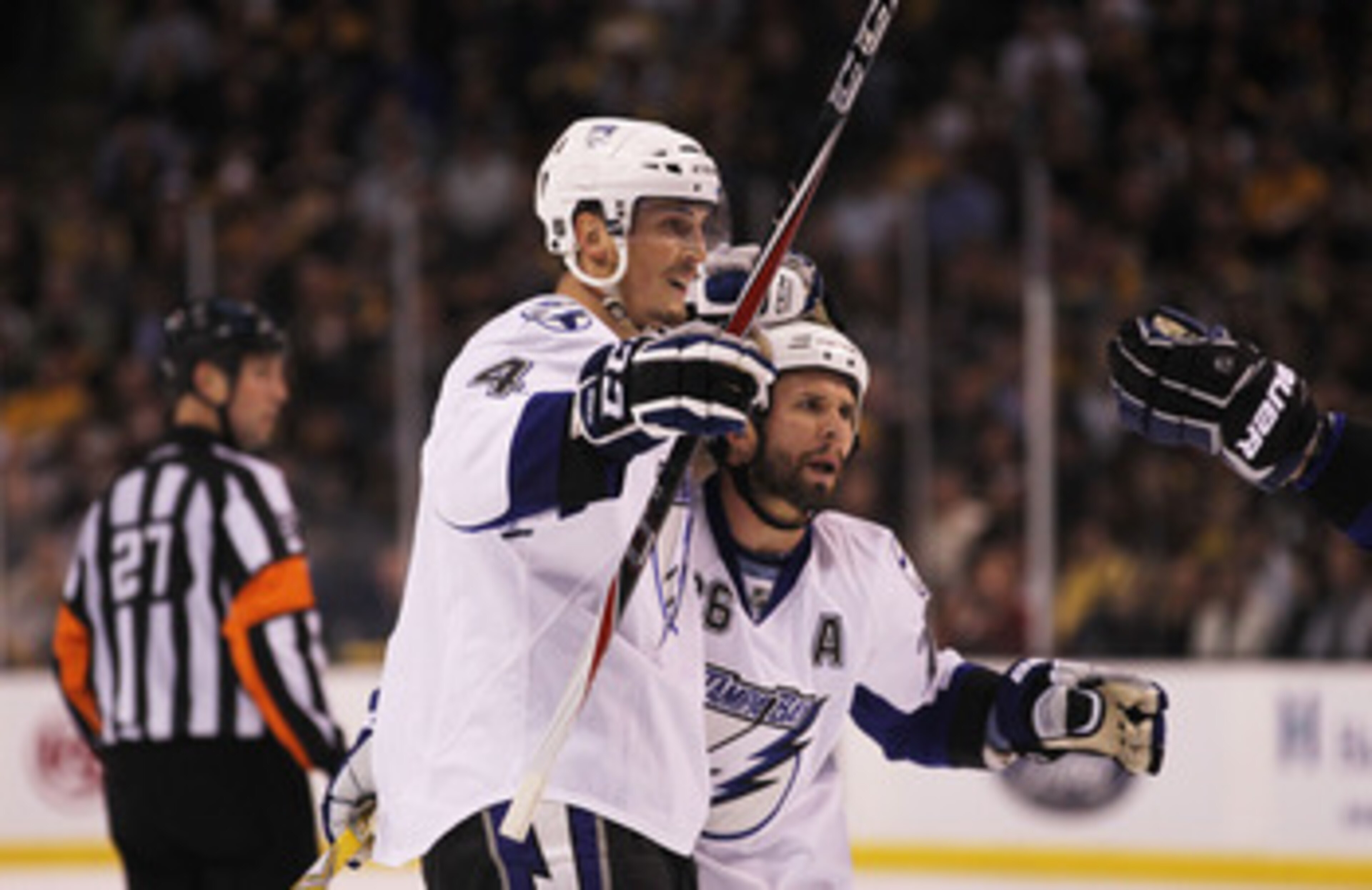 BOSTON, MA - MAY 17:  Vincent Lecavalier #4 celebrates with Martin St. Louis #26 of the Tampa Bay Lightning after Lecavalier scored a second period power play goal against the Boston Bruins in Game Two of the Eastern Conference Finals during the 2011 NHL 