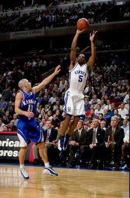 Wayne Turner #5 of the Kentucky Wildcats shoots as Jeff Boschee #13 of the Kansas Jayhawks blocks at the United Center in Chicago, Illinois. Kentucky defeated Kansas 63-45. Wayne Turner #5 of the Kentucky Wildcats shoots as Jeff Boschee #13 of the Kansas Jayhawks blocks at the United Center in Chicago, Illinois. Kentucky defeated Kansas 63-45.