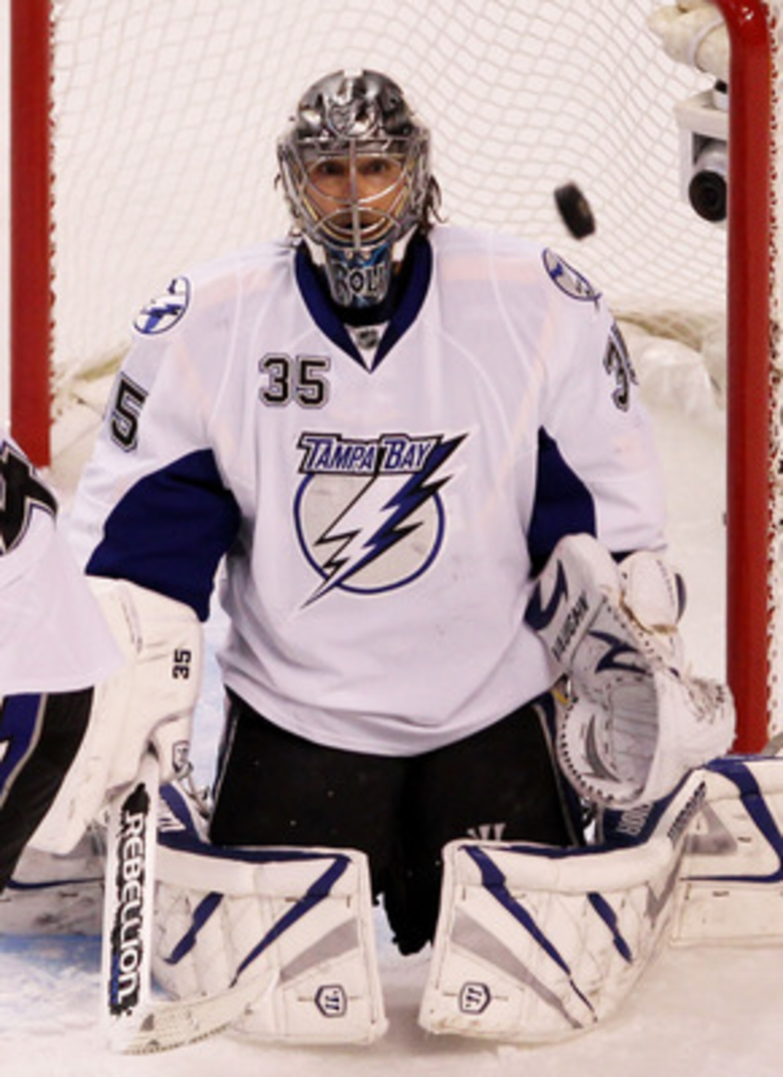 BOSTON, MA - MAY 17:  Dwayne Roloson #35 of the Tampa Bay Lightning watches a puck shot be the Boston Bruins fly wide in the first period of Game Two of the Eastern Conference Finals during the 2011 NHL Stanley Cup Playoffs at TD Garden on May 17, 2011 in