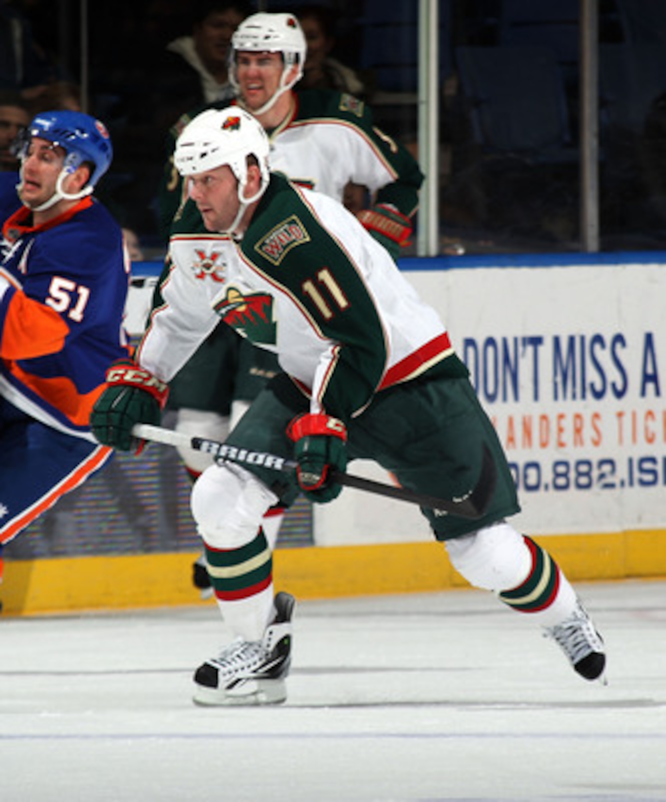 UNIONDALE, NY - MARCH 02:  John Madden #11 of the Minnesota Wild skates against the New York Islanders at the Nassau Coliseum on March 2, 2011 in Uniondale, New York. The Islanders defeated the Wild 4-1.  (Photo by Bruce Bennett/Getty Images)
