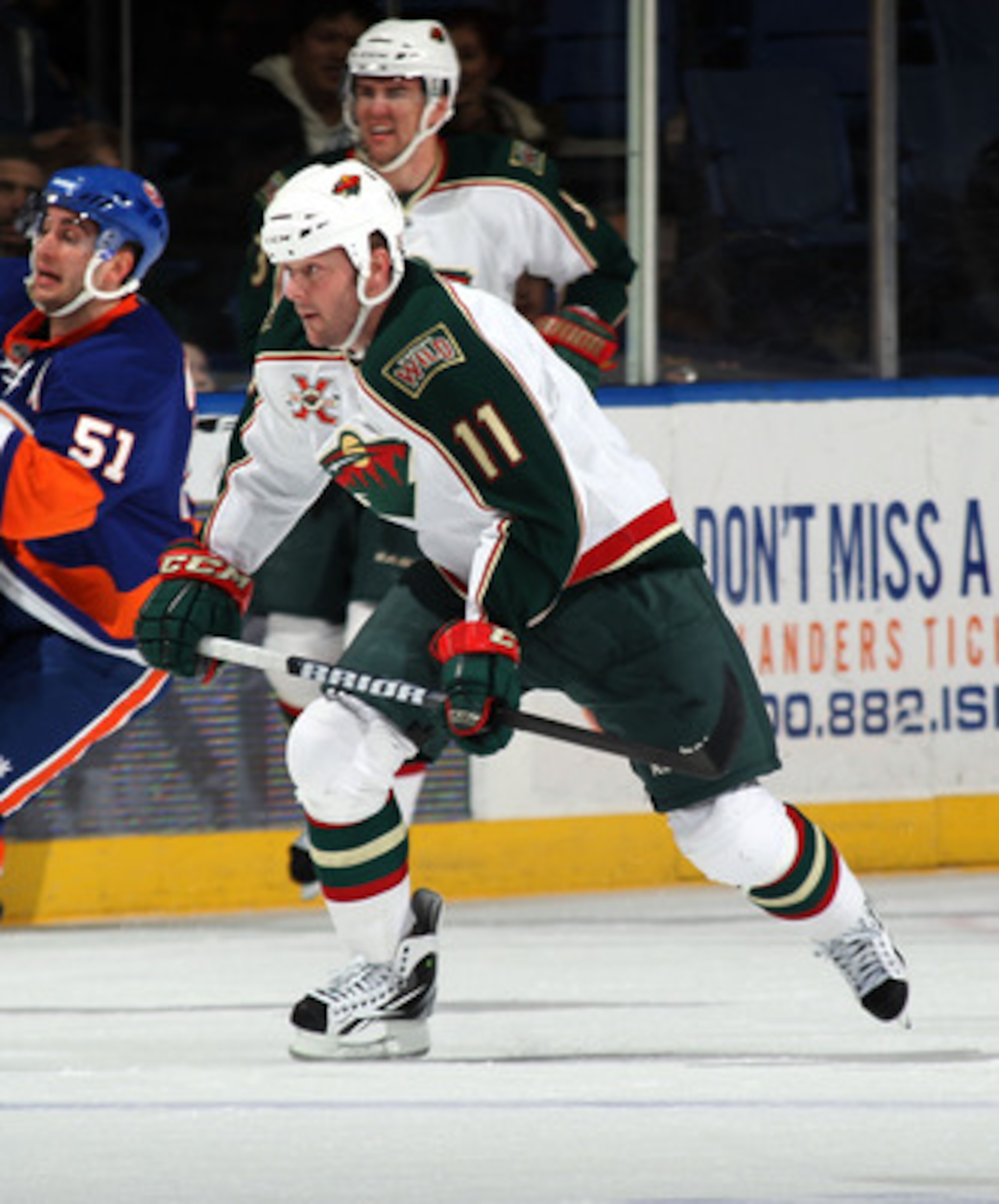UNIONDALE, NY - MARCH 02:  John Madden #11 of the Minnesota Wild skates against the New York Islanders at the Nassau Coliseum on March 2, 2011 in Uniondale, New York. The Islanders defeated the Wild 4-1.  (Photo by Bruce Bennett/Getty Images)