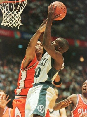 Tony Delk (right) of Kentucky shoots over John Wallace of Syracuse during the 1996 NCAA Men''s Basketball Championship at the Continental Air Arena in East Rutherford, New Jersey. Tony Delk (right) of Kentucky shoots over John Wallace of Syracuse during the 1996 NCAA Men''s Basketball Championship at the Continental Air Arena in East Rutherford, New Jersey.
