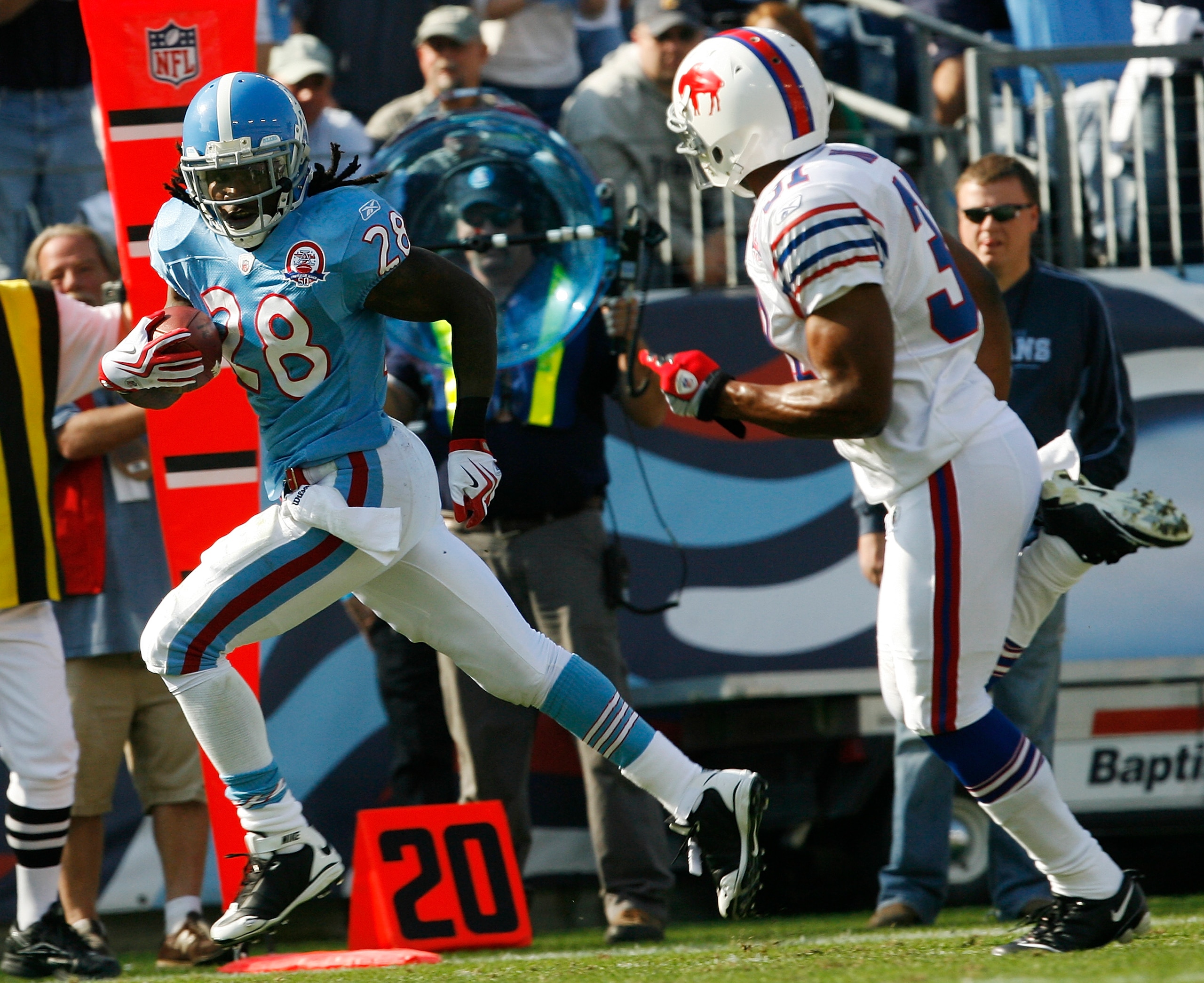 NASHVILLE, TN - NOVEMBER 15: Chris Johnson #28 of the Tennessee Titans breaks free from Jairus Byrd #31 of the Buffalo Bills for a touchdown in their NFL game at LP Field on November 15, 2009 in Nashville, Tennessee.    (Photo by John Sommers II/Getty Ima