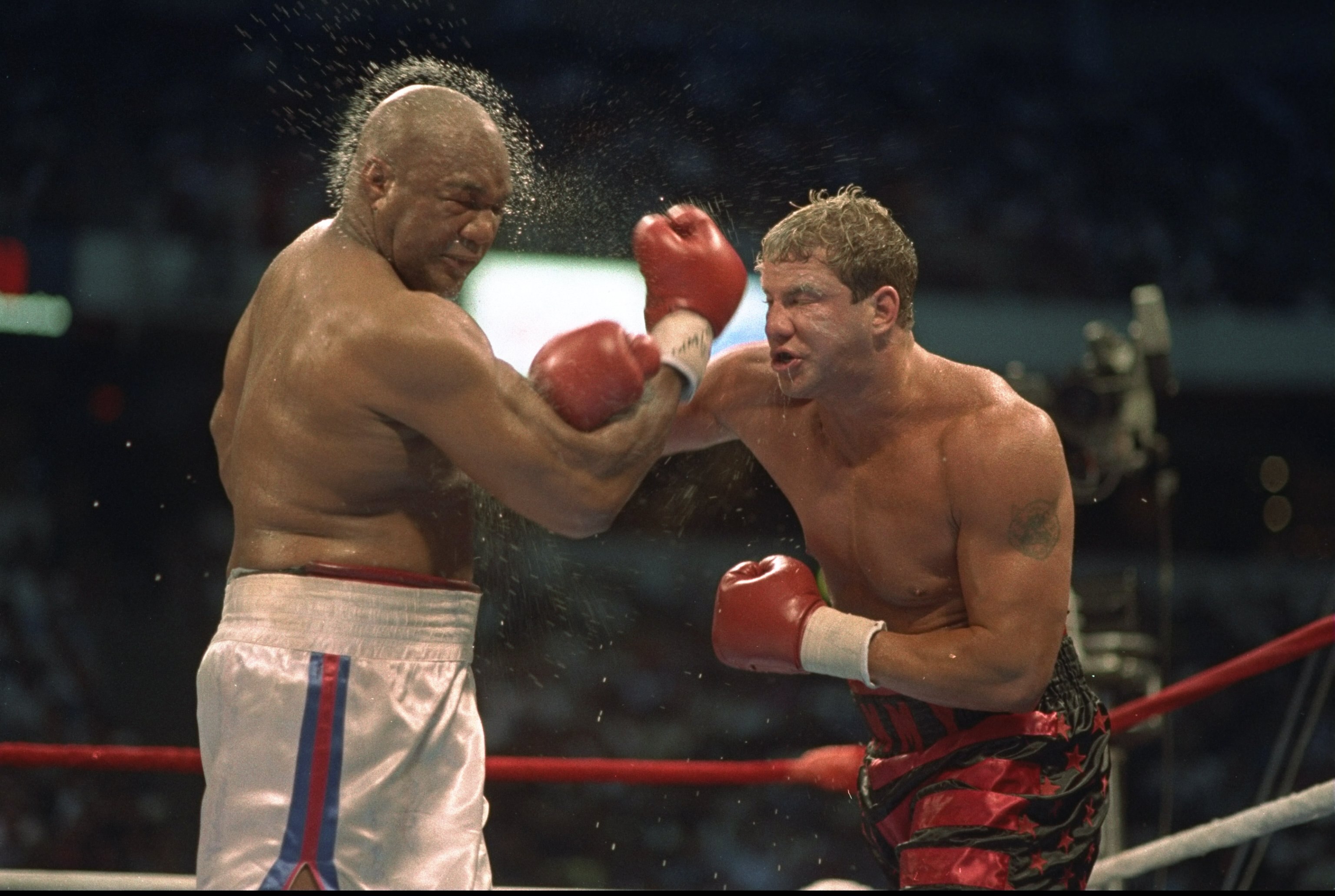 6 Jul 1987:  George Foreman of the USA suffers at the hands of Tommy Morrison of the USA in Las Vegas, Nevada, USA. \ Mandatory Credit: Allsport UK /Allsport