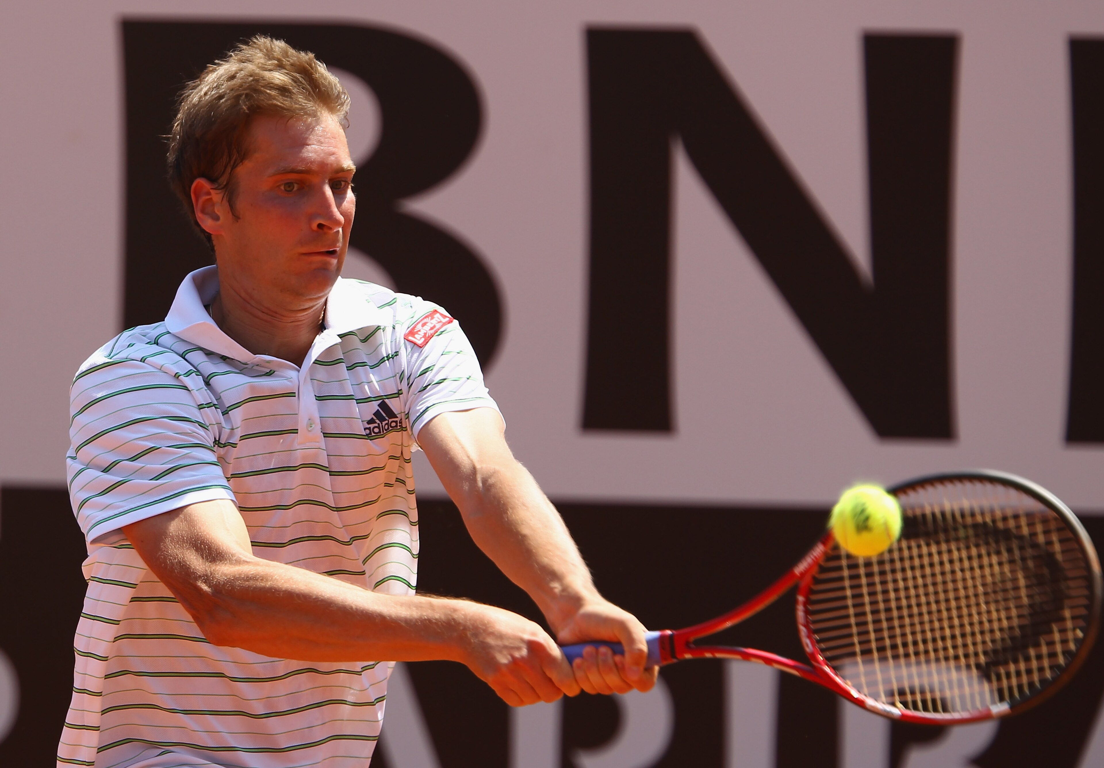 ROME, ITALY - MAY 13:  Florian Mayer of Germany plays a backhand during his quarter final match against Andy Murray of Great Britain during day six of the Internazoinali BNL D'Italia at the Foro Italico Tennis Centre  on May 13, 2011 in Rome, Italy.  (Pho