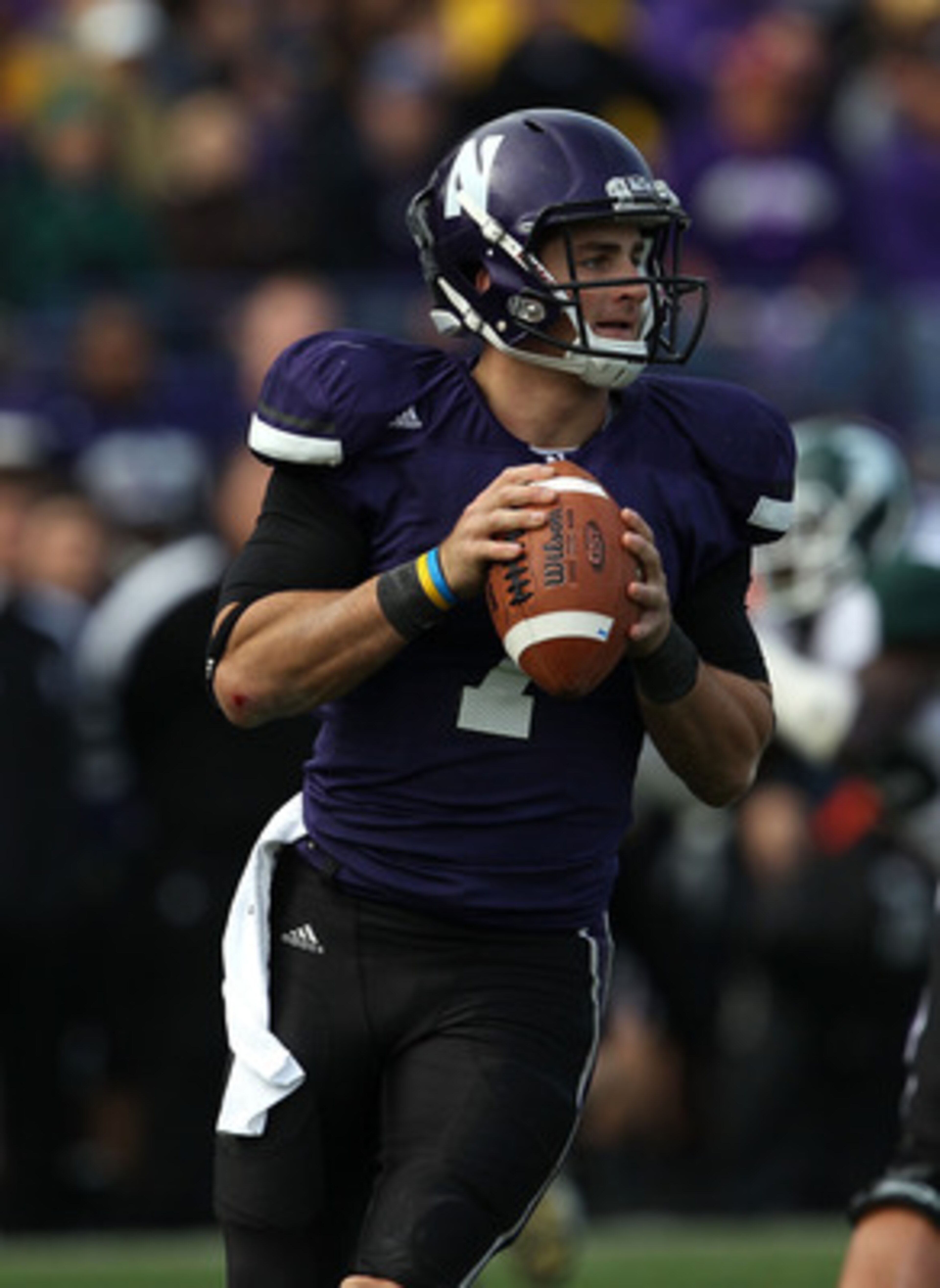 EVANSTON, IL - OCTOBER 23: Dan Persa #7 of the Northwestern Wildcats looks for a receiver against the Michigan State Spartans at Ryan Field on October 23, 2010 in Evanston, Illinois. Michigan State defeated Northwestern 35-27. (Photo by Jonathan Daniel/Ge EVANSTON, IL - OCTOBER 23: Dan Persa #7 of the Northwestern Wildcats looks for a receiver against the Michigan State Spartans at Ryan Field on October 23, 2010 in Evanston, Illinois. Michigan State defeated Northwestern 35-27. (Photo by Jonathan Daniel/Ge