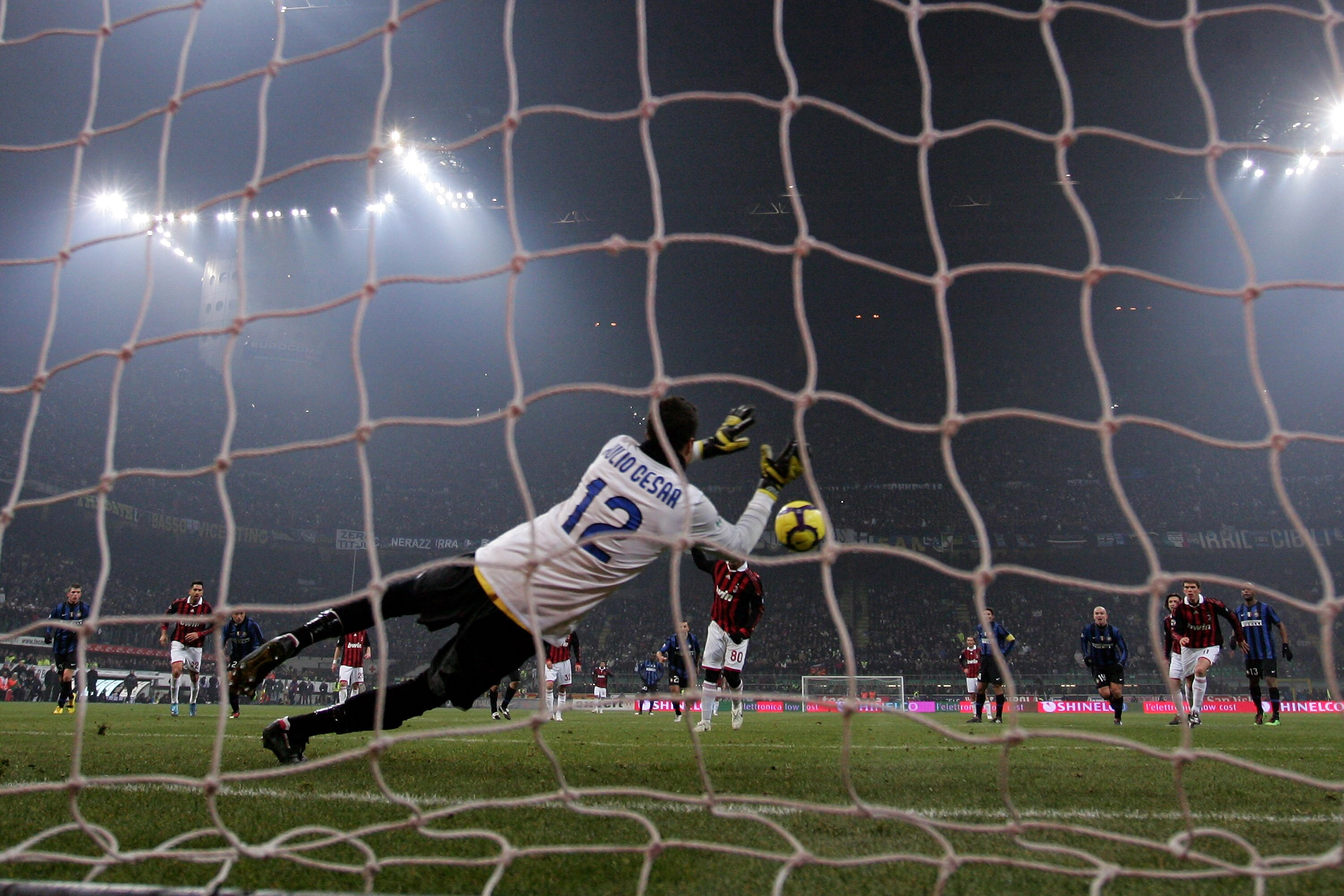 MILAN, ITALY - JANUARY 24:  Julio Cesar of Inter saves a penalty from Ronaldhino of Milan during the Serie A match between Inter Milan and AC Milan at Stadio Giuseppe Meazza on January 24, 2010 in Milan, Italy.  (Photo by Michael Steele/Getty Images)
