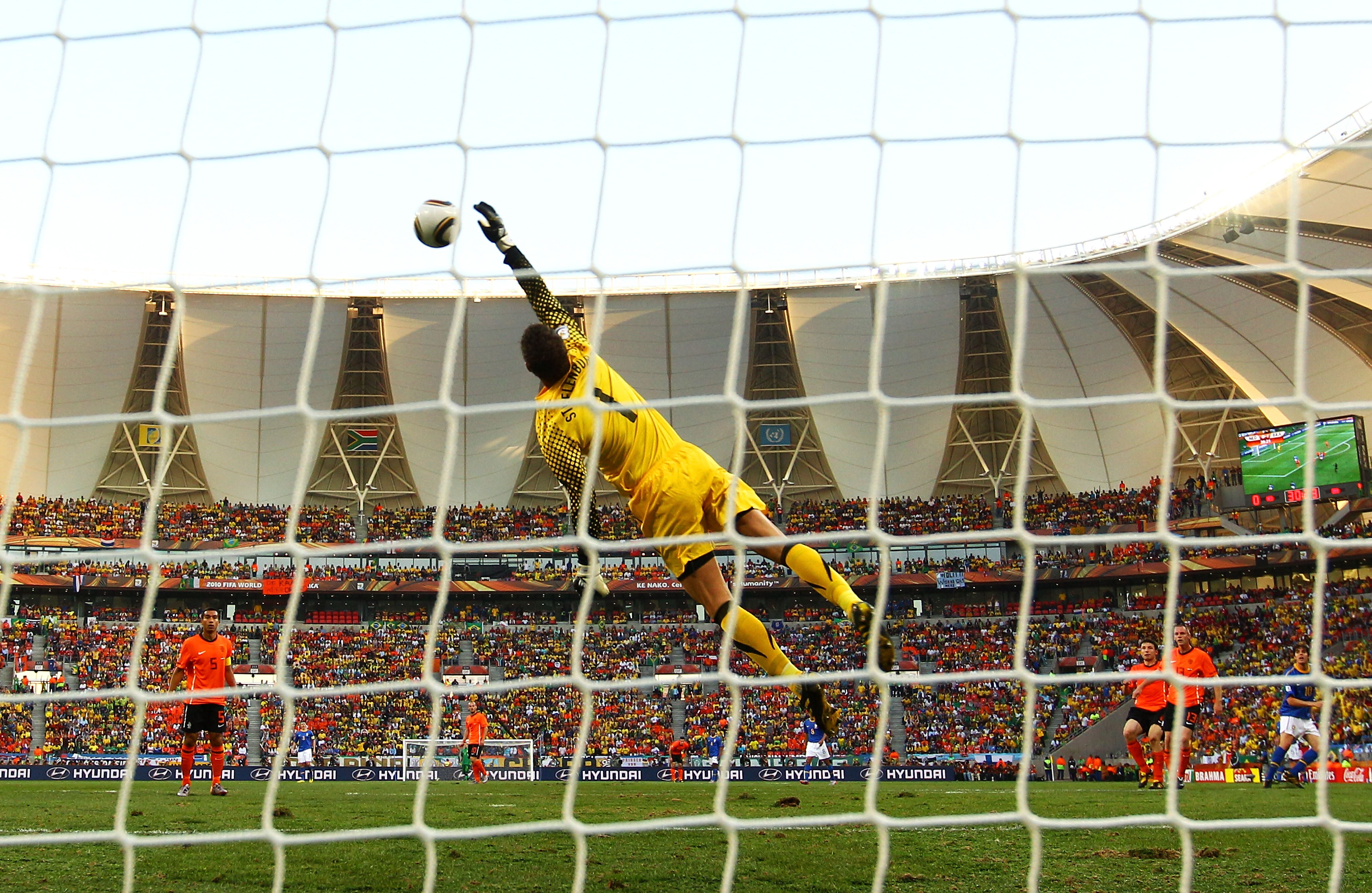 PORT ELIZABETH, SOUTH AFRICA - JULY 02: Maarten Stekelenburg of the Netherlands makes a diving save from a Kaka shot during the 2010 FIFA World Cup South Africa Quarter Final match between Netherlands and Brazil at Nelson Mandela Bay Stadium on July 2, 20