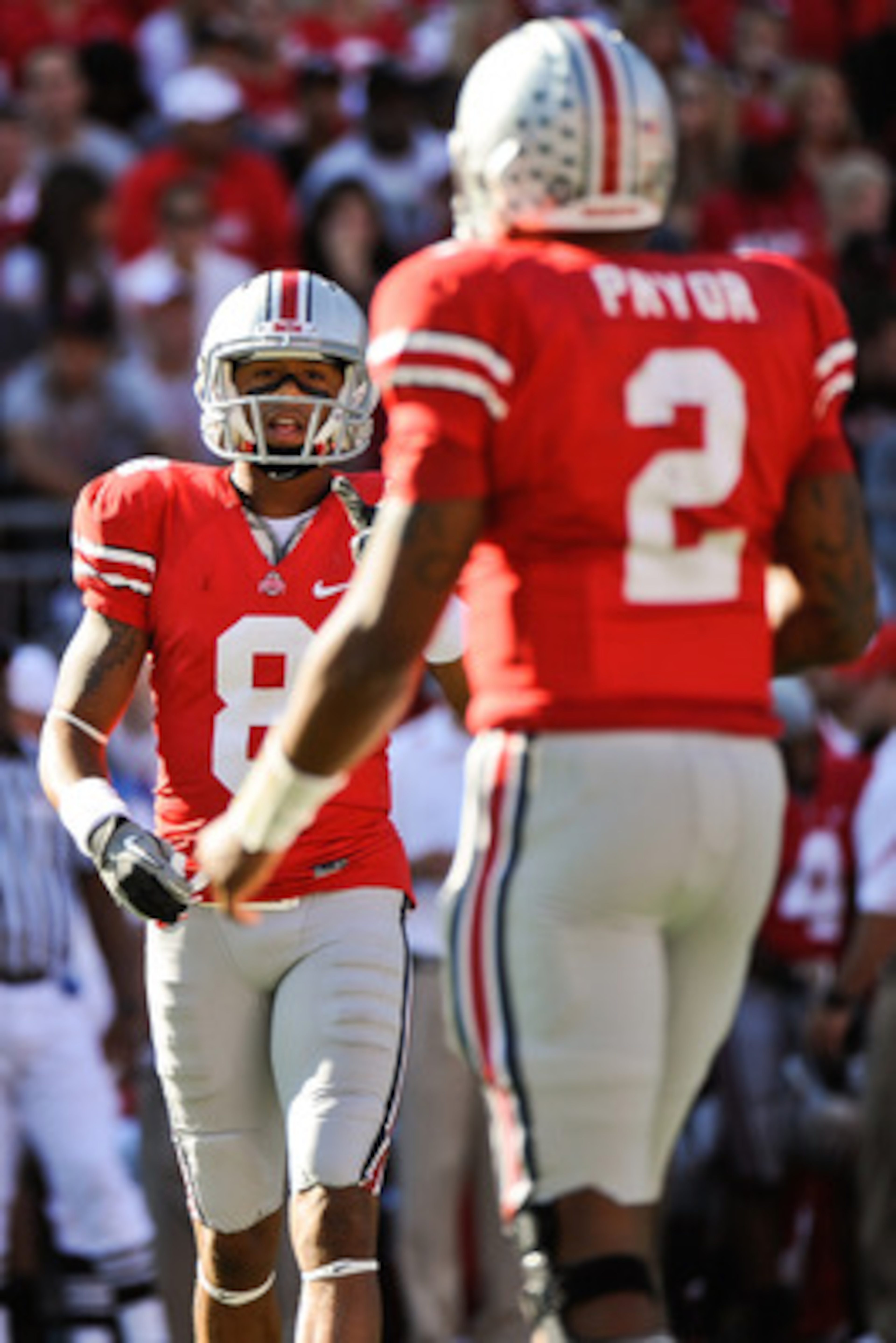 COLUMBUS, OH - SEPTEMBER 25: DeVier Posey #8 of the Ohio State Buckeyes has a discussion with quarterback Terrelle Pryor #2 of the Ohio State Buckeyes during a game against the Eastern Michigan Eagles at Ohio Stadium on September 25, 2010 in Columbus, Oh COLUMBUS, OH - SEPTEMBER 25: DeVier Posey #8 of the Ohio State Buckeyes has a discussion with quarterback Terrelle Pryor #2 of the Ohio State Buckeyes during a game against the Eastern Michigan Eagles at Ohio Stadium on September 25, 2010 in Columbus, Oh