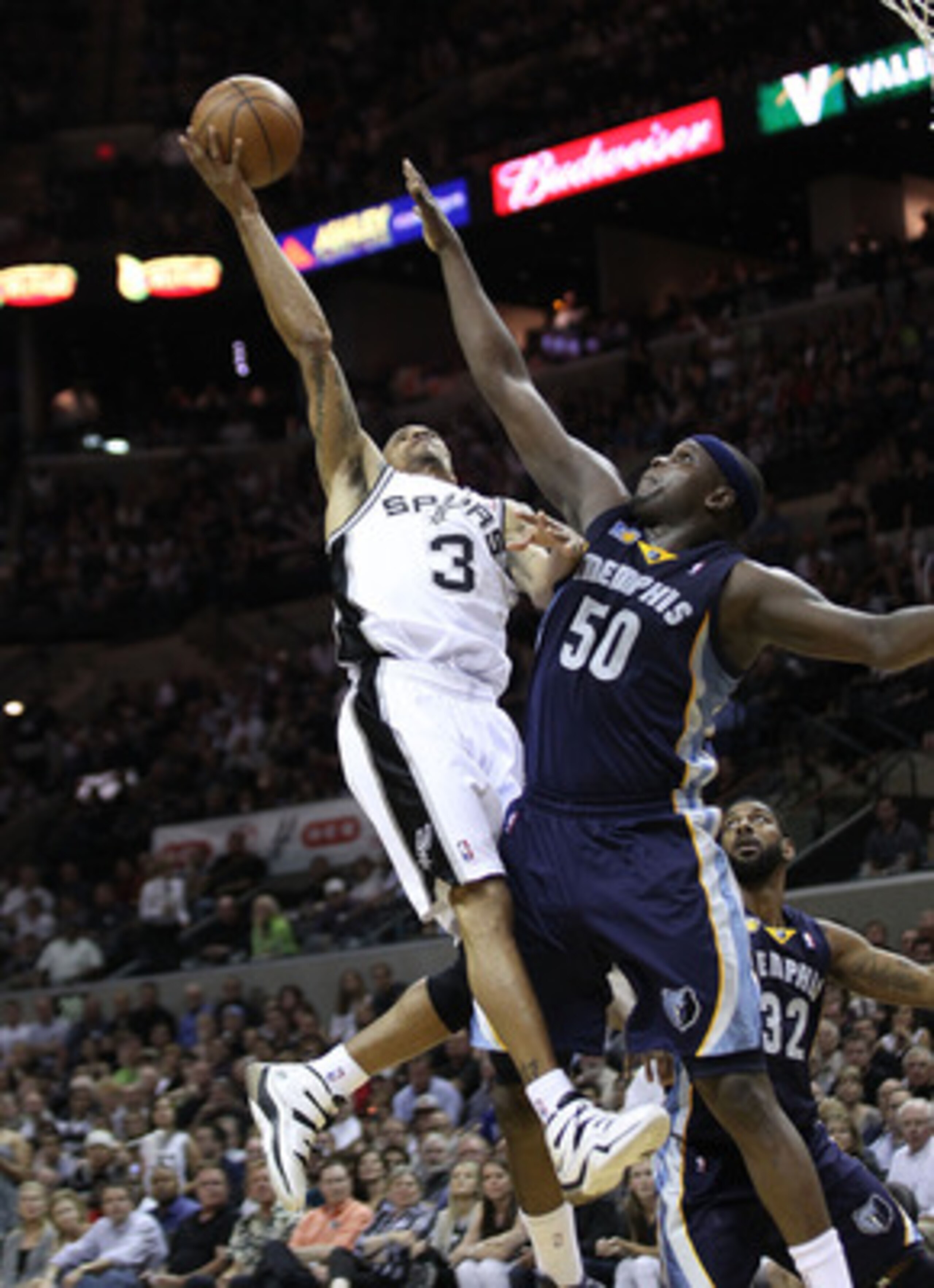 SAN ANTONIO, TX - APRIL 27:  George Hill #3 of the San Antionio Spurs shoots over Zach Randolph #50 of the Memphis Grizzlies in Game Five of the Western Conference Quarterfinals in the 2011 NBA Playoffs on April 27, 2011 at AT&T Center in San Antonio, Tex