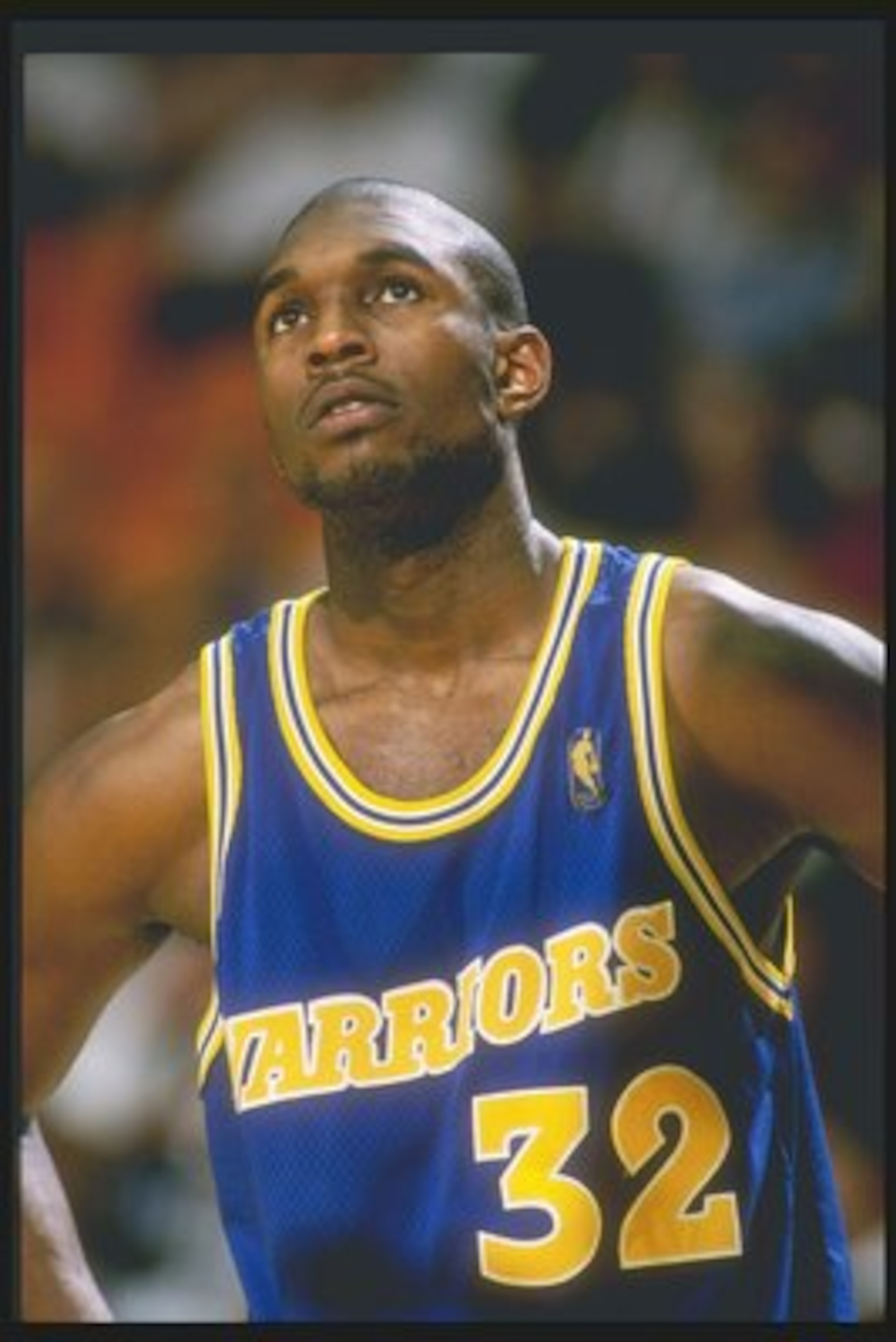 12 Mar 1997: Forward Joe Smith of the Golden State Warriors stands on the court during a game against the Los Angeles Lakers at the Great Western Forum in Inglewood, California. The Lakers won the game 109-101.