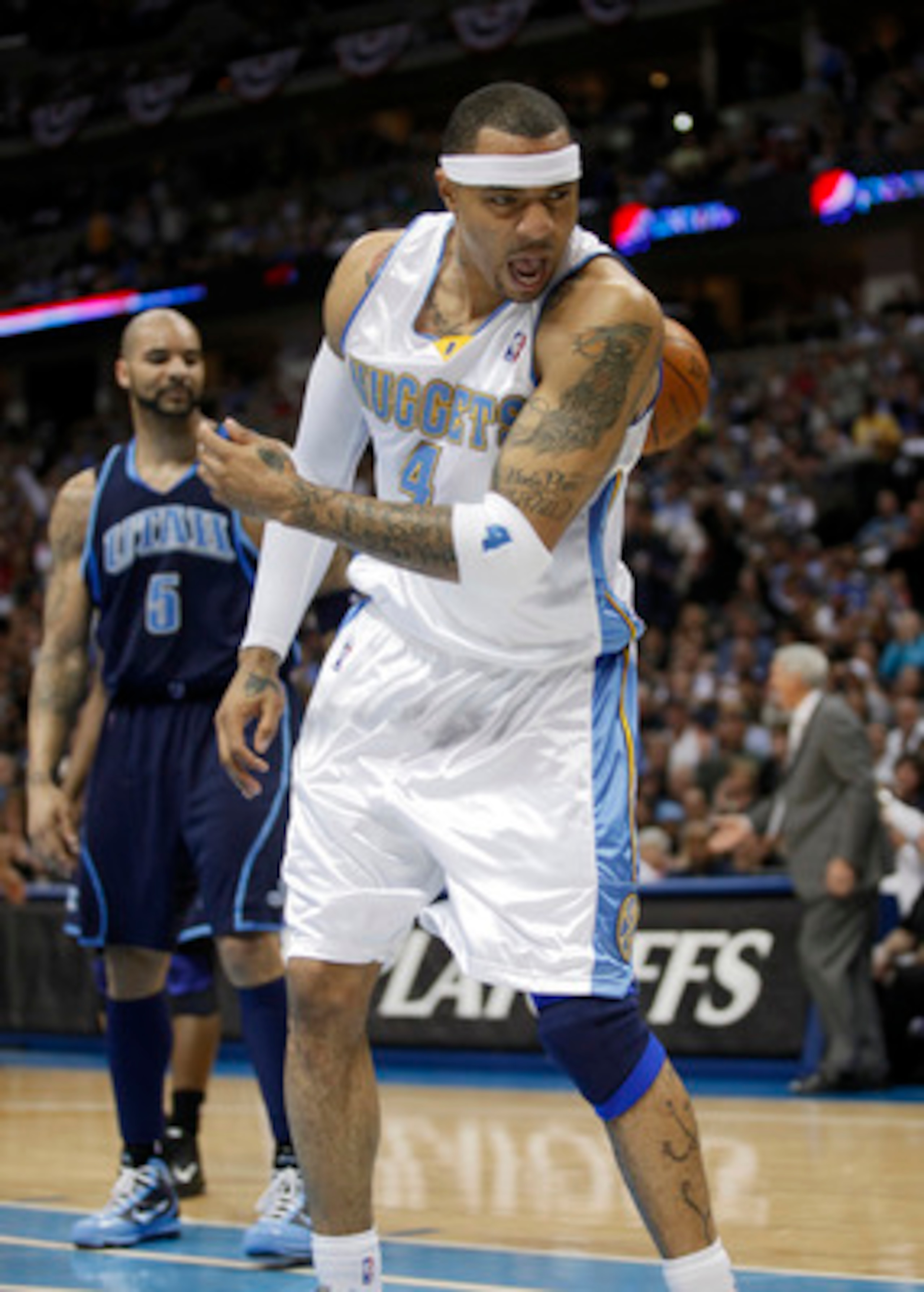 DENVER, CO - APRIL 17 : Kenyon Martin #4 of the Denver Nuggets reacts after dunking the ball in front of Carlos Boozer #5 of the Utah Jazz during the first half of Game One of the Western Conference Quarterfinals of the 2010 NBA Playoffs at the Pepsi Cent